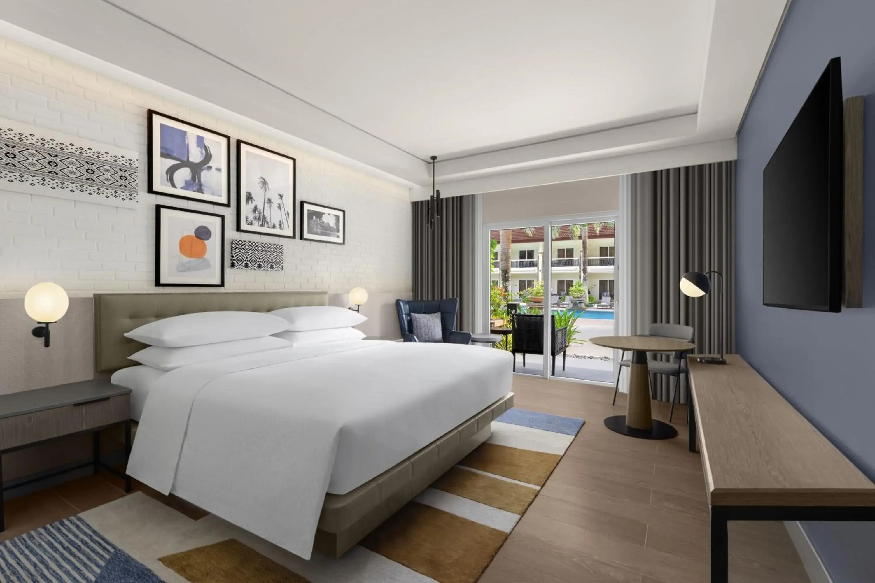 Deluxe King Room with Balcony and Pool View in Four Points by Sheraton Palawan Puerto Princesa Deluxe King Room with Balcony and Pool View in Four Points by Sheraton Palawan Puerto Princesa