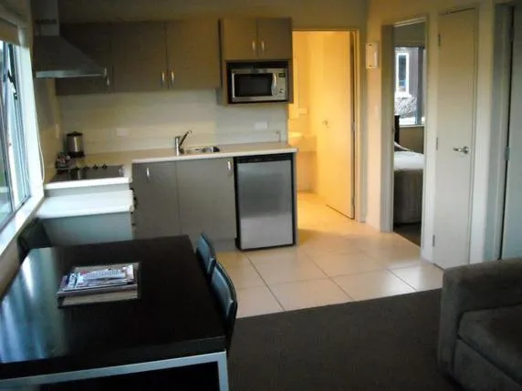 Kitchen or kitchenette in St Johns court motel