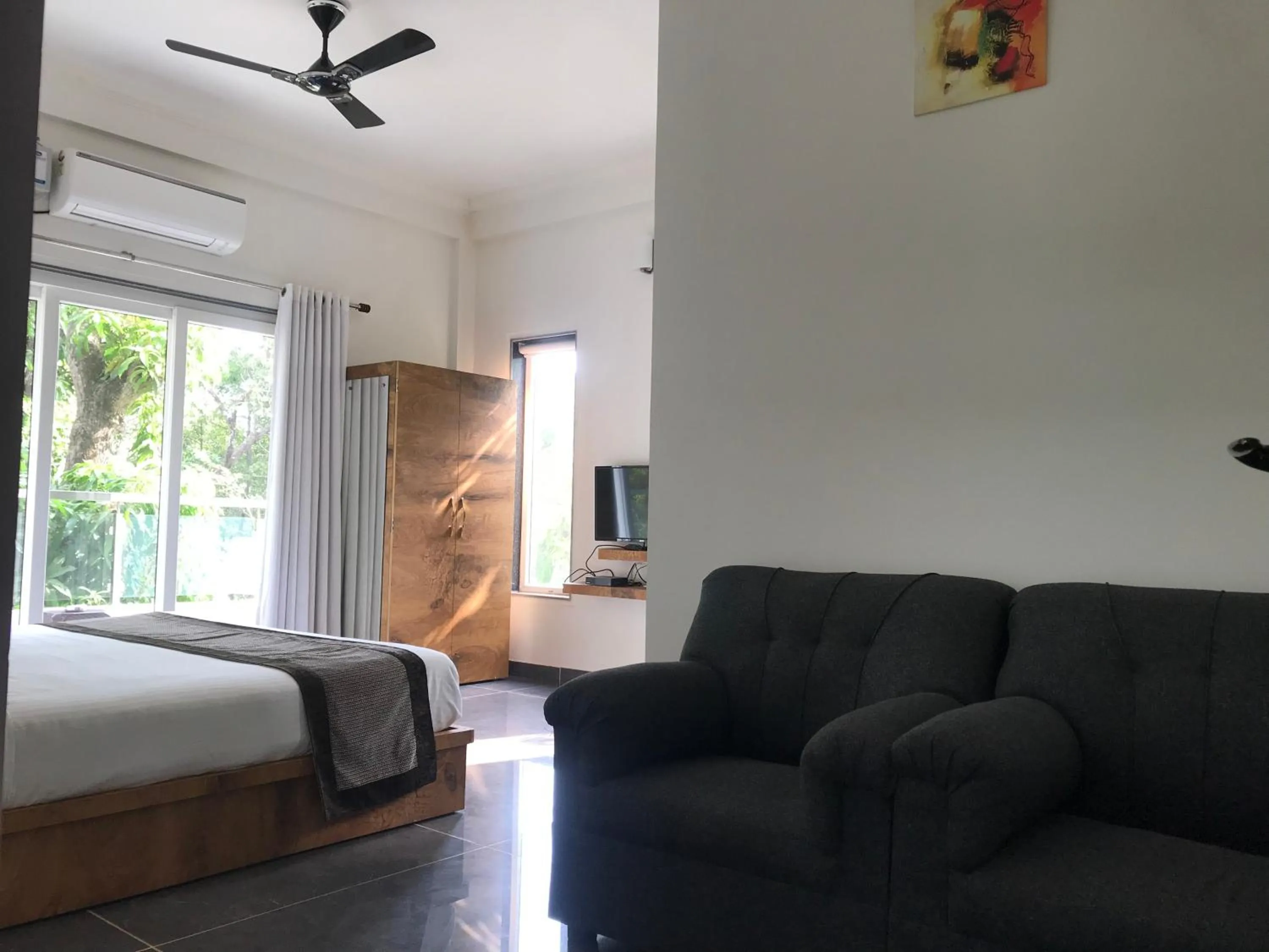 Seating area, Bed in Rankk Stays