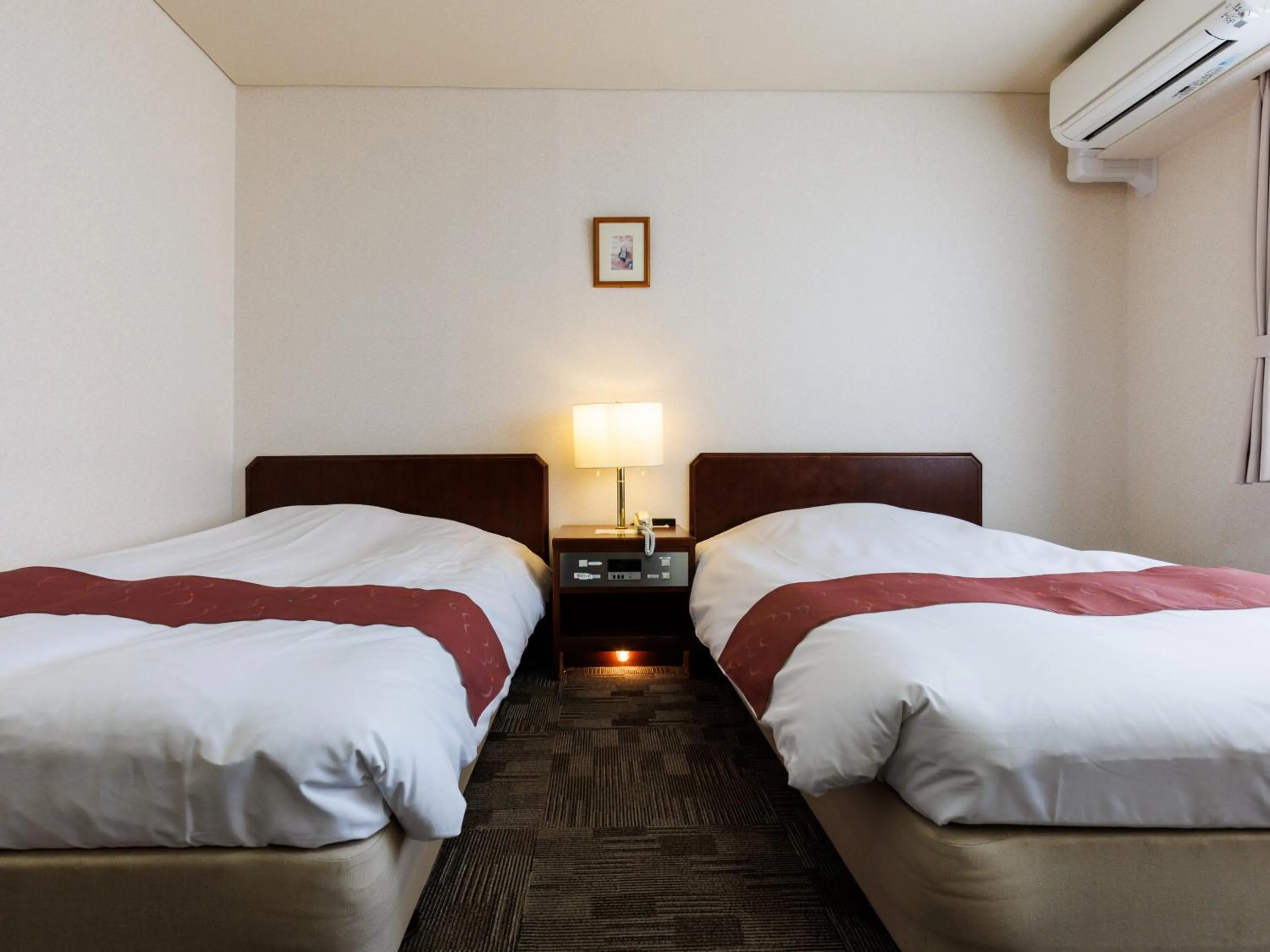 Bed in Tabist Hotel Nemuro Kaiyoutei