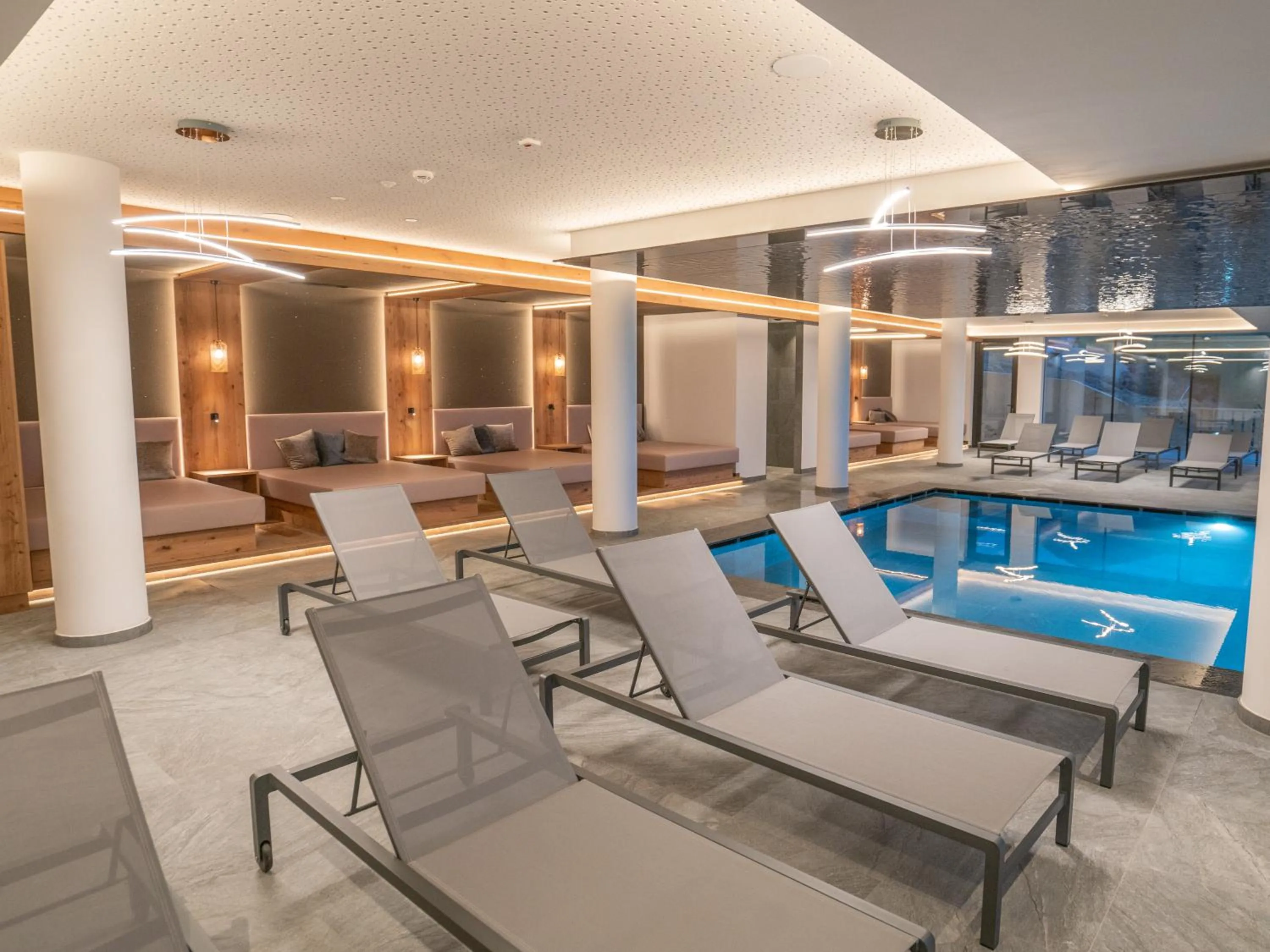 Swimming pool in Hotel Purvita by Oberlechner