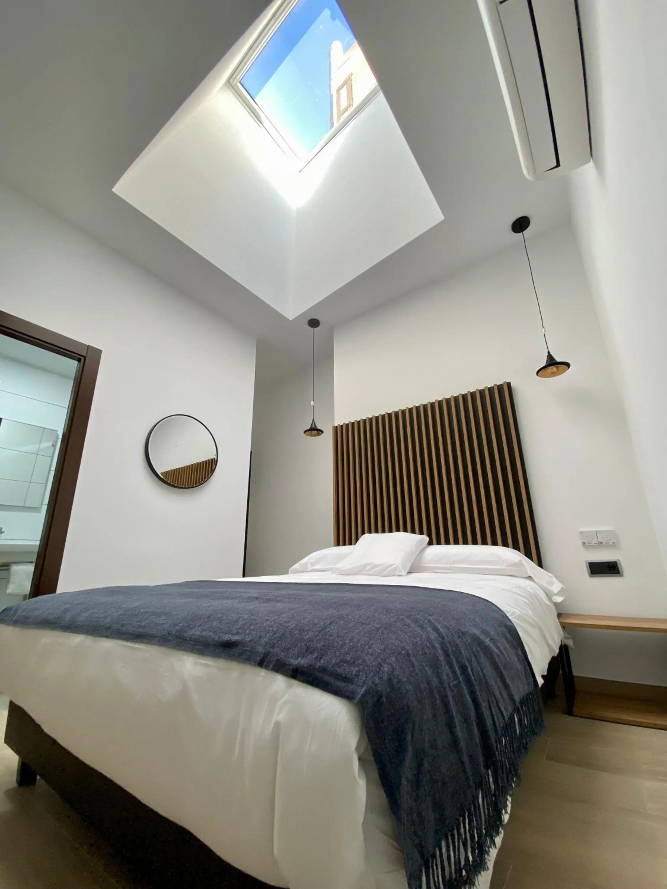 Bed in Evenia Alcalá Boutique Hotel