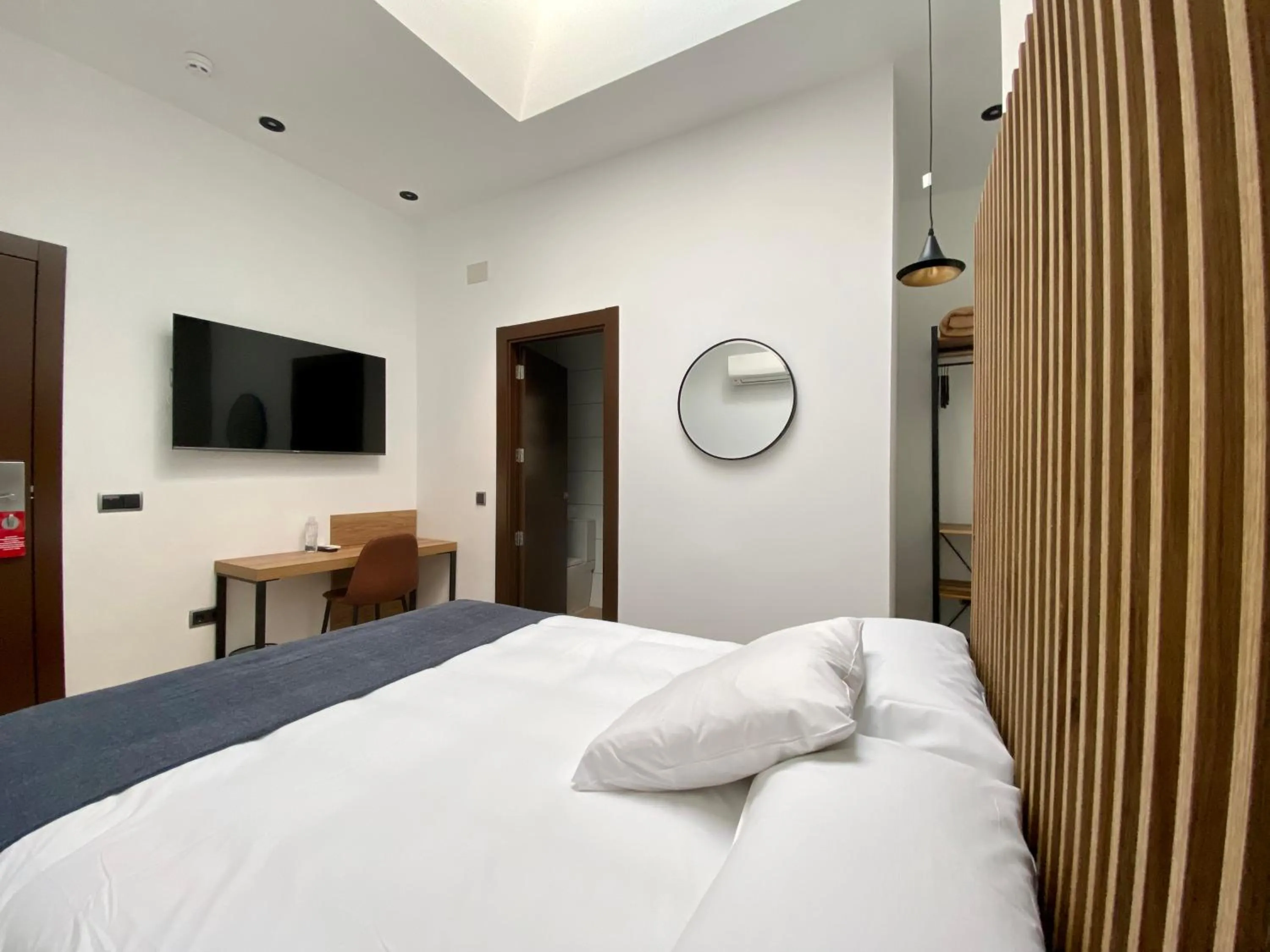 Bed in Evenia Alcalá Boutique Hotel