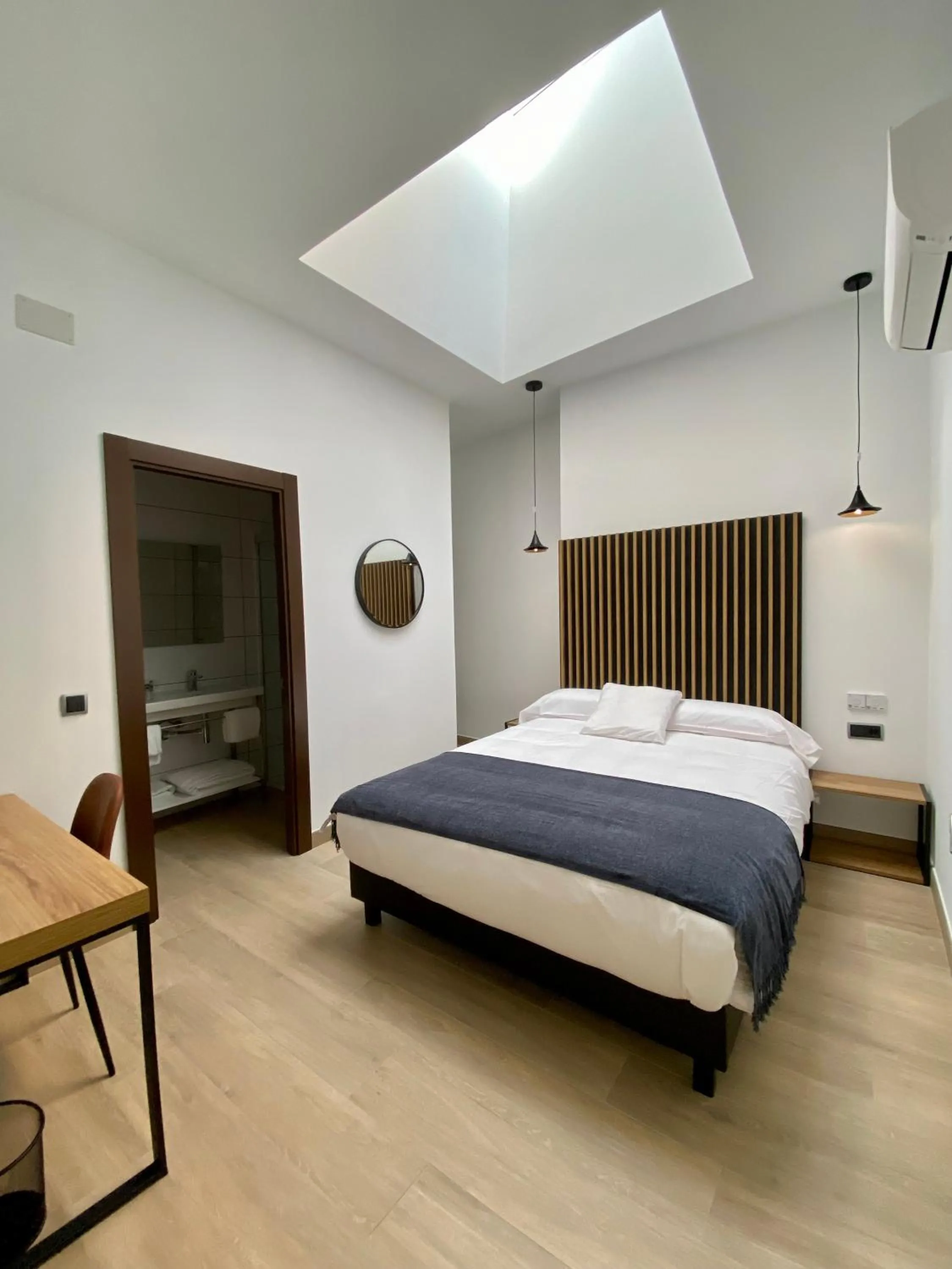 Bed in Evenia Alcalá Boutique Hotel