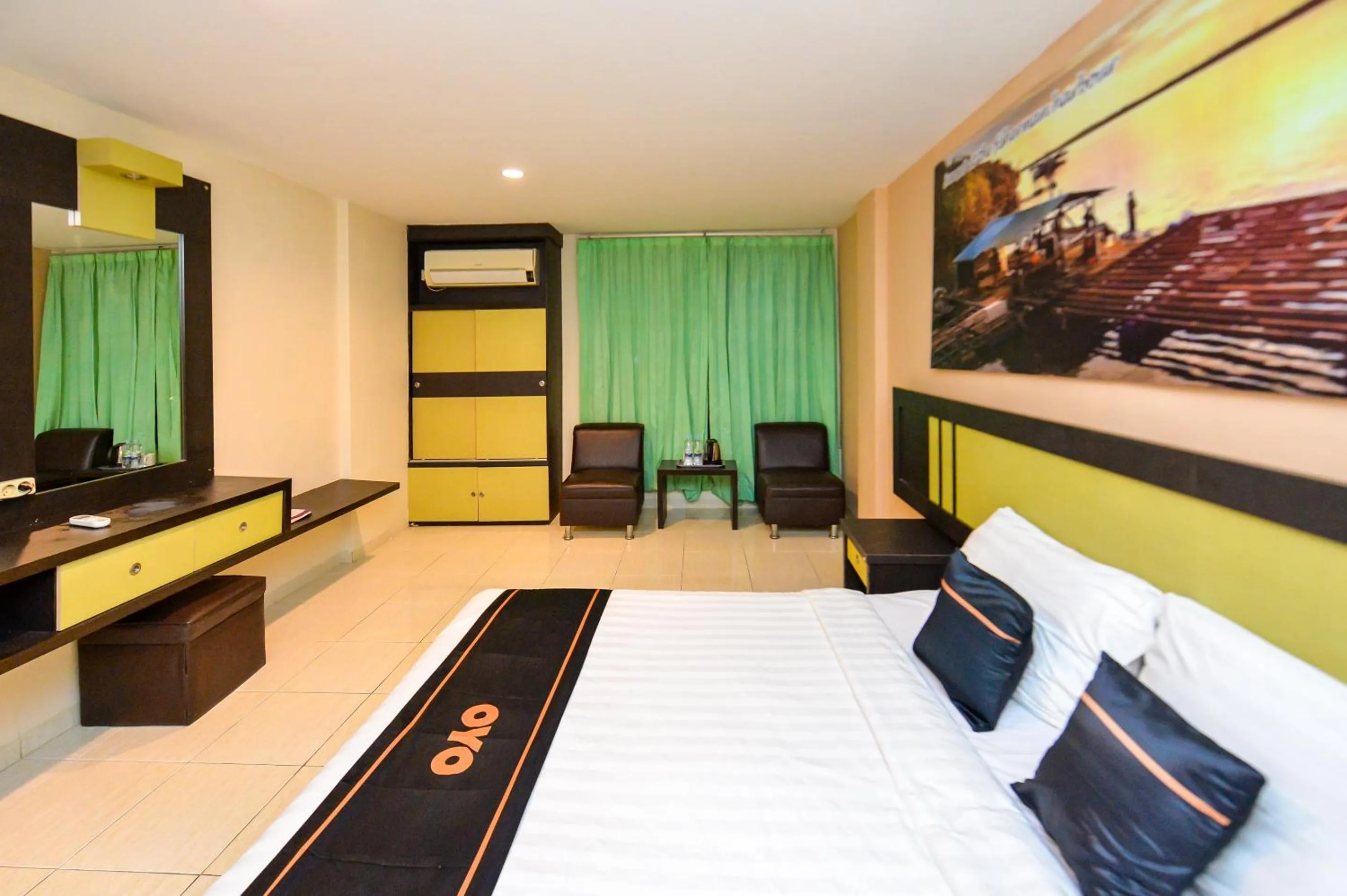 Bedroom in OYO 2487 Sampurna Jaya Hotel