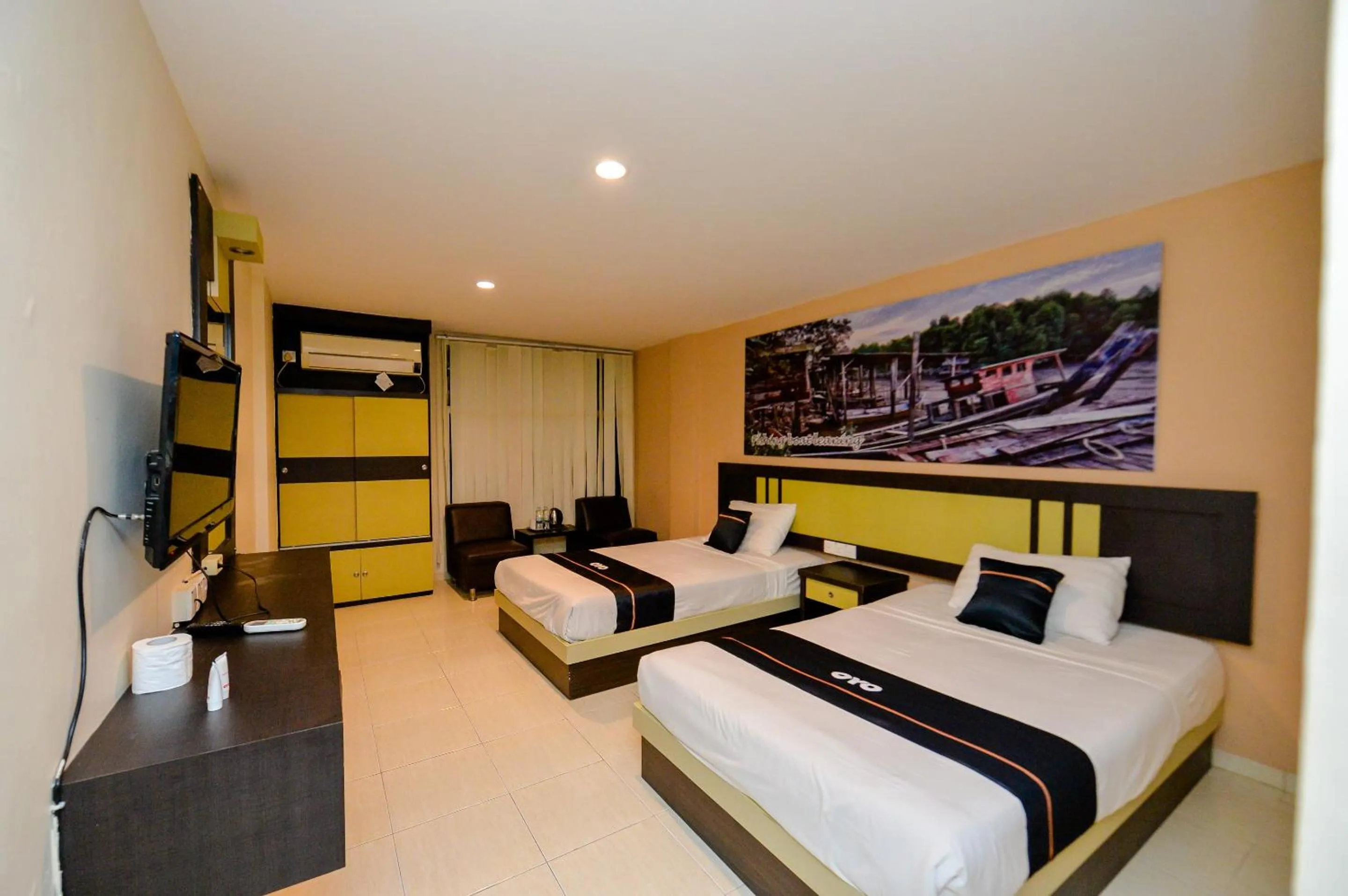 Bedroom in OYO 2487 Sampurna Jaya Hotel