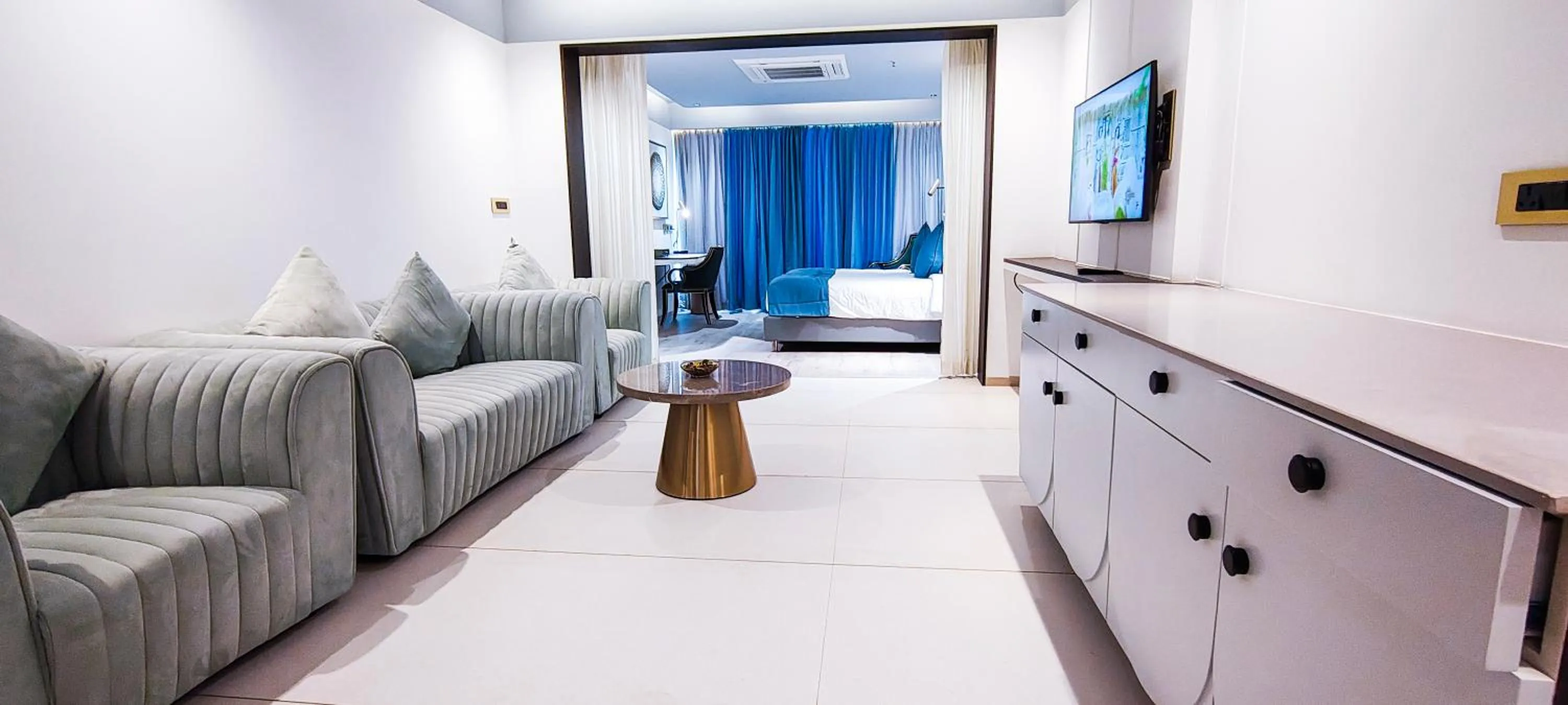 Communal lounge/ TV room in Pushpak Grande