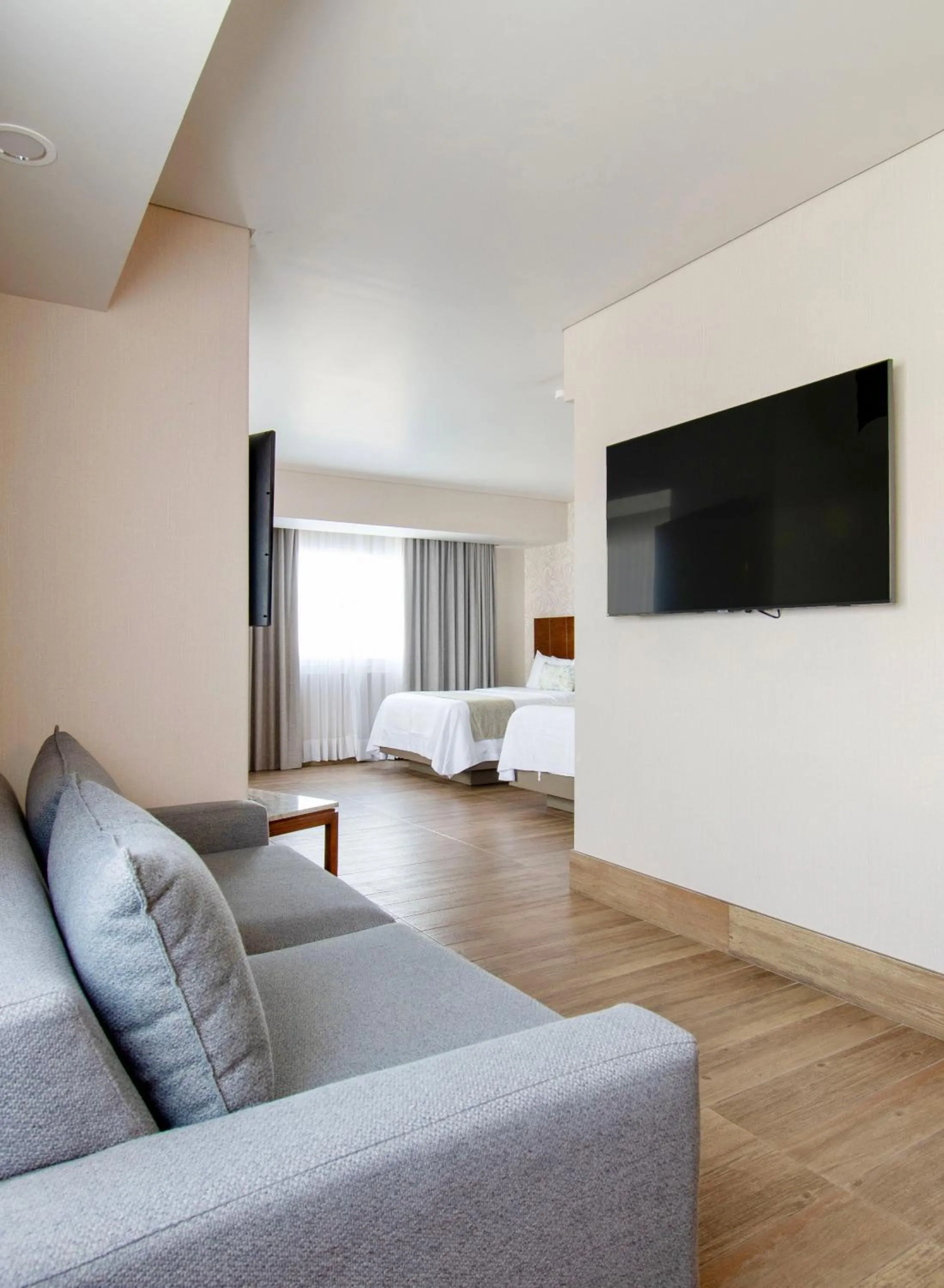 Communal lounge/ TV room, Bed in Hotel Plaza Diana