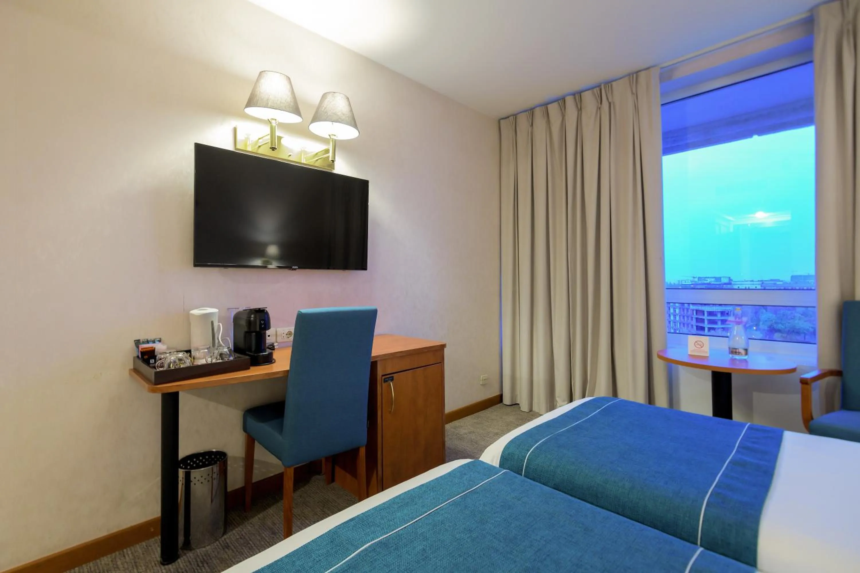 TV and multimedia in Ramada by Wyndham Bucharest Parc Hotel