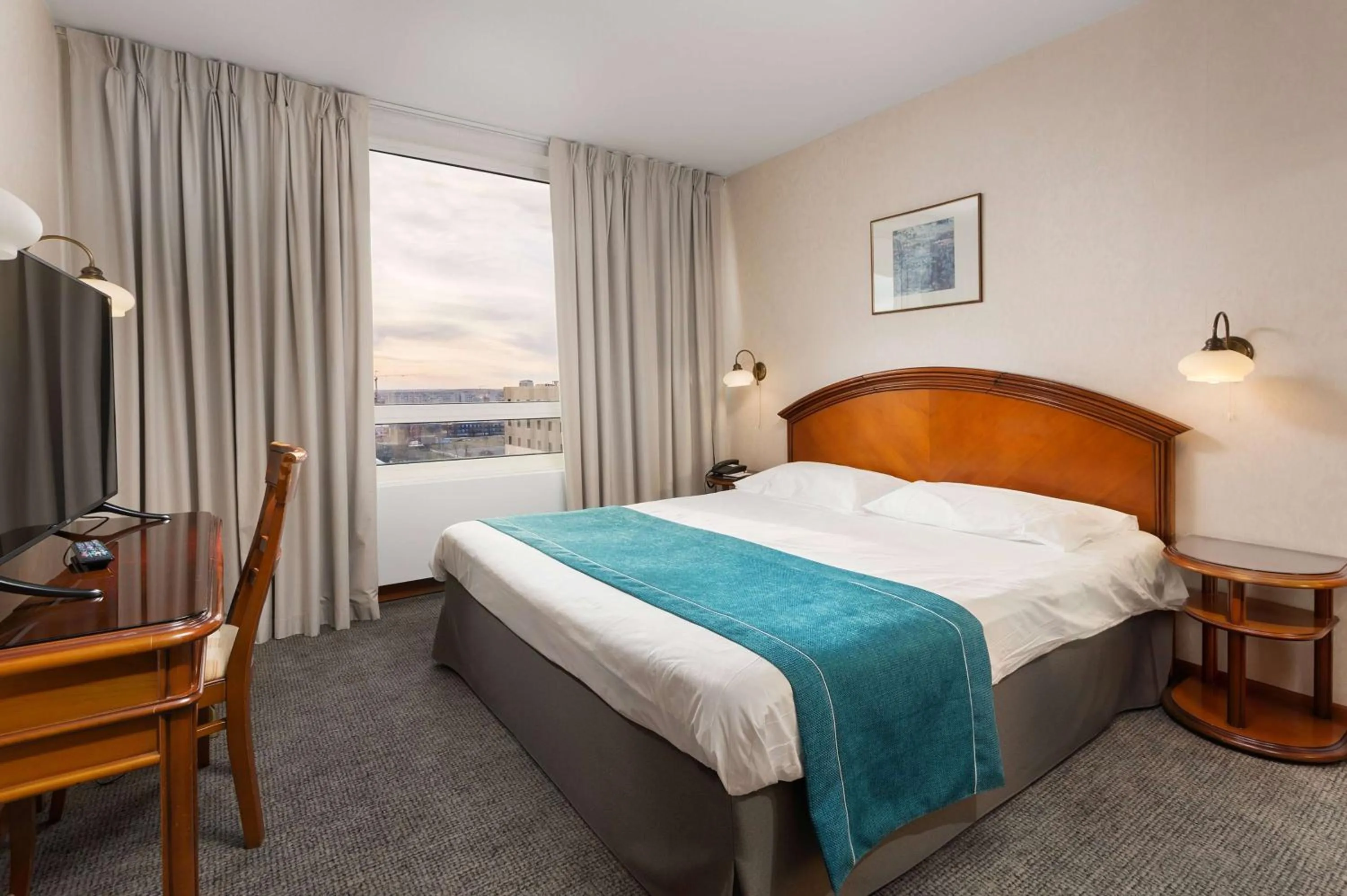 Bed in Ramada by Wyndham Bucharest Parc Hotel