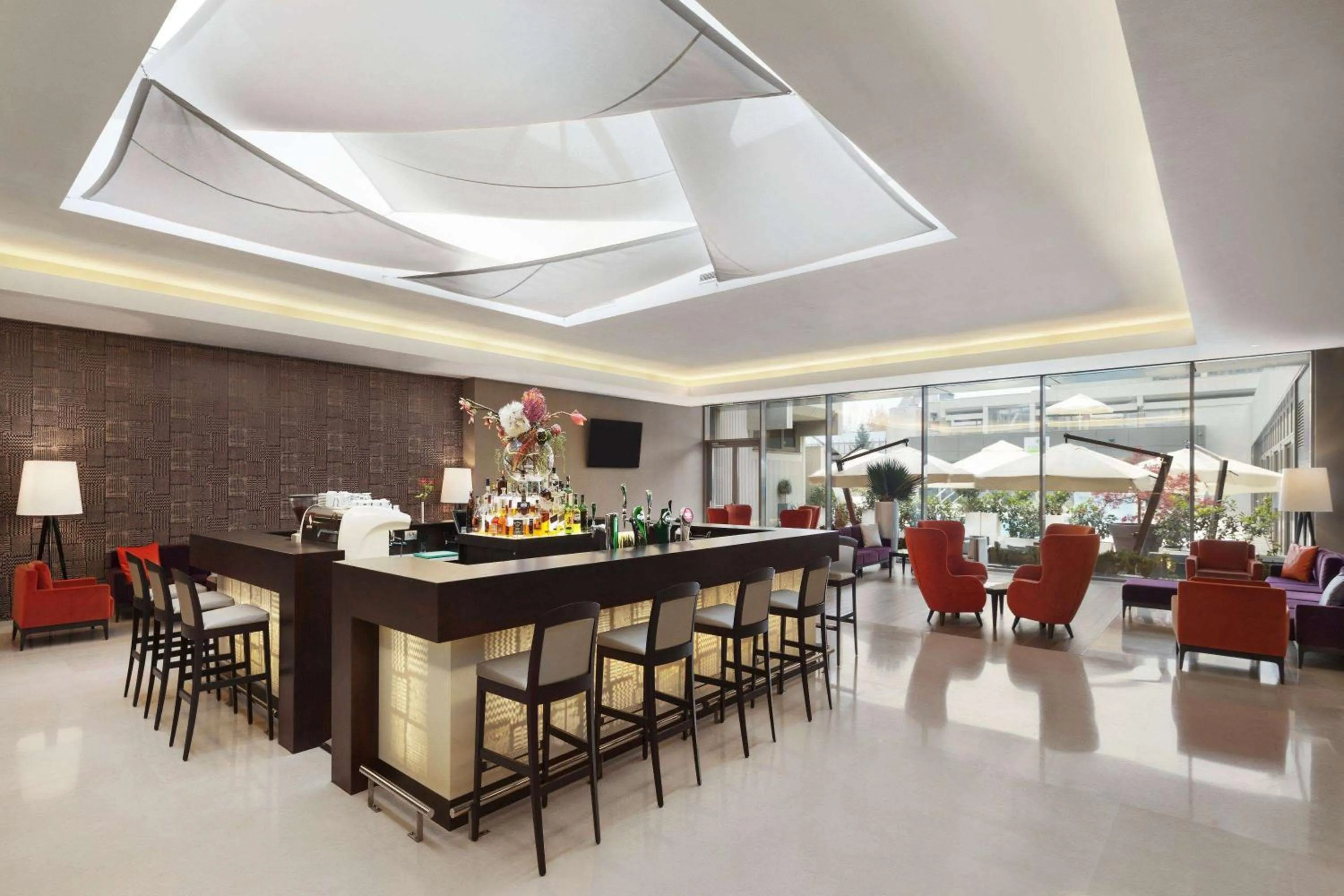 Lounge or bar in Ramada by Wyndham Bucharest Parc Hotel