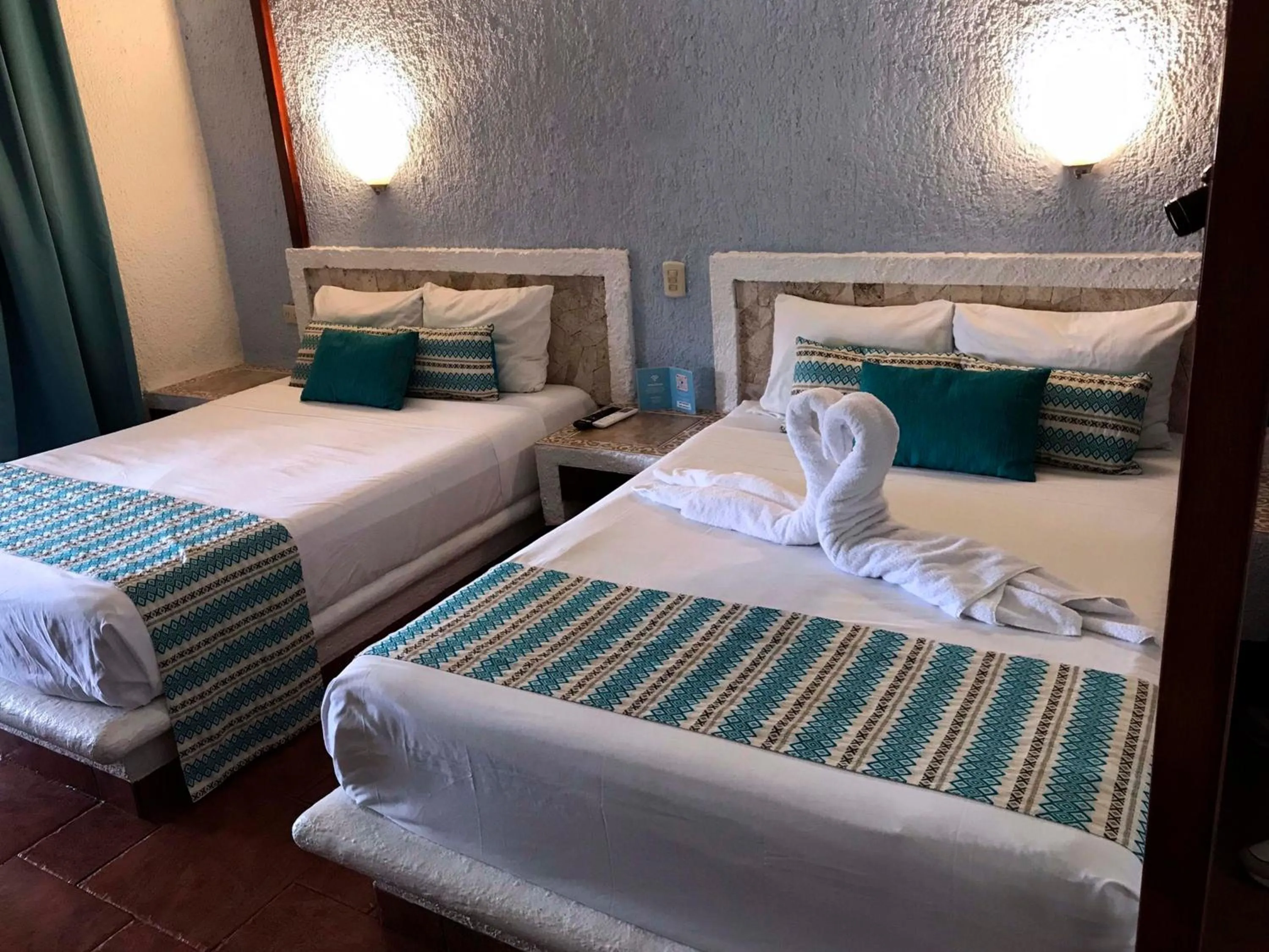 Bed in Chez Waffle Hotel