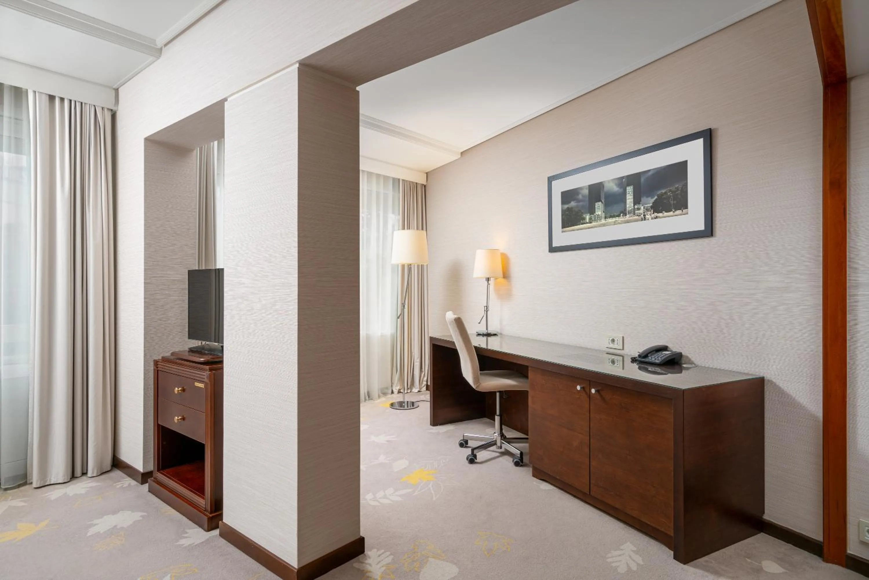 Communal lounge/ TV room in Crowne Plaza Bucharest by IHG