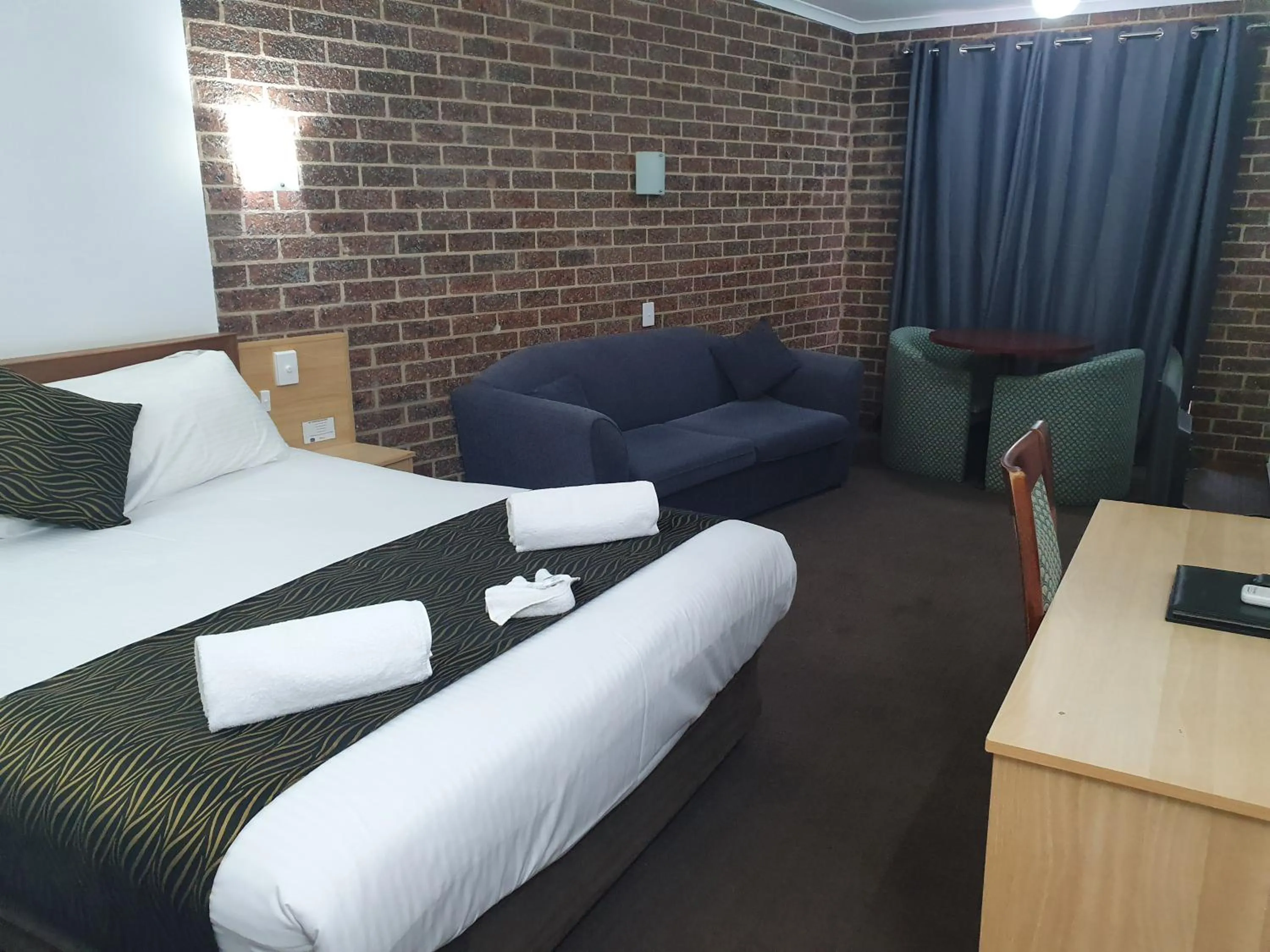 Bed in Moonraker Motor Inn