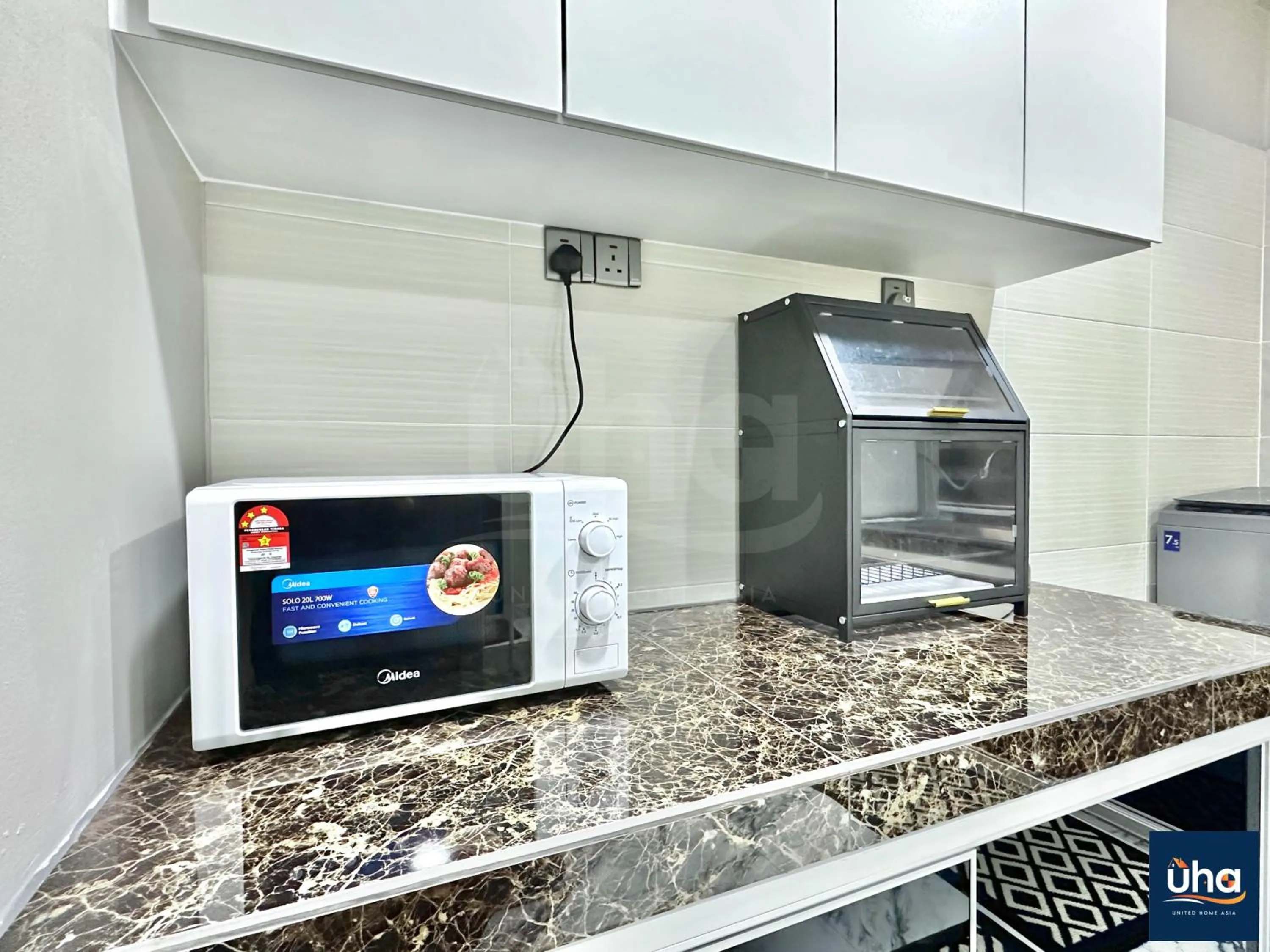 microwave in Akademik Suite by JK Home