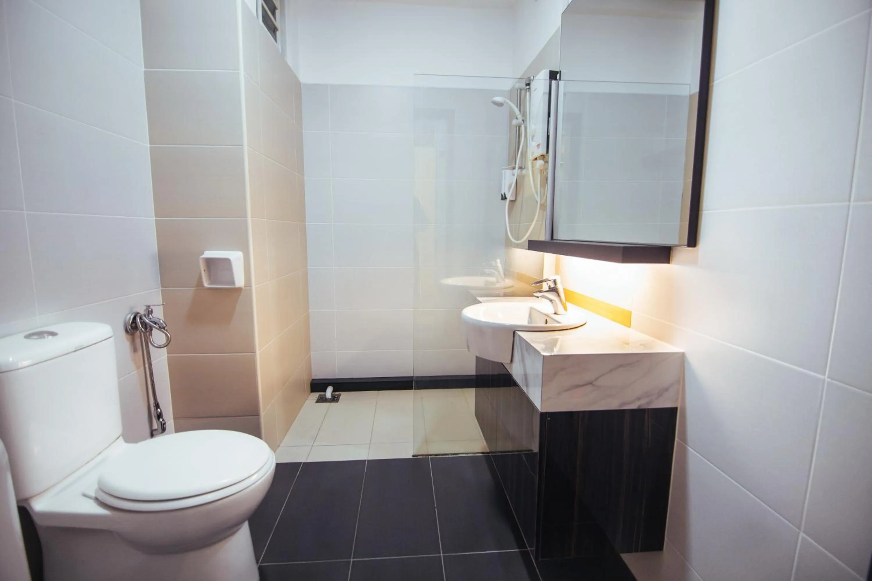 Bathroom in Akademik Suite by JK Home