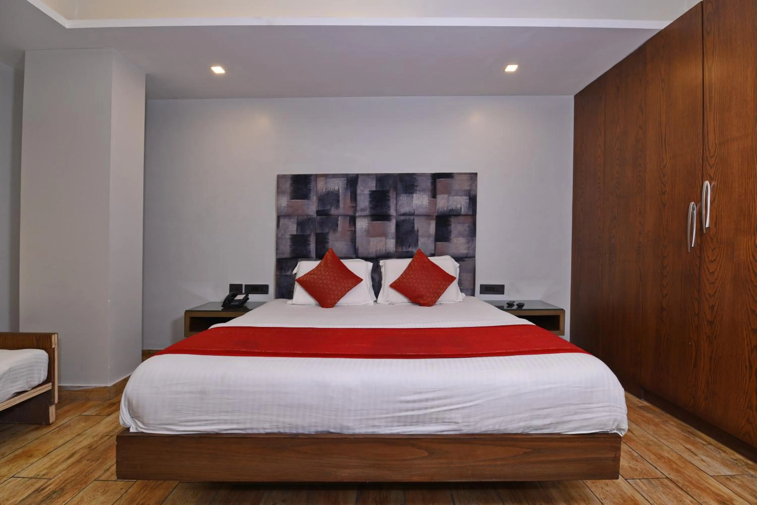 Bed in Staybook Hotel Nitya Maharani, Free Airport Pickup