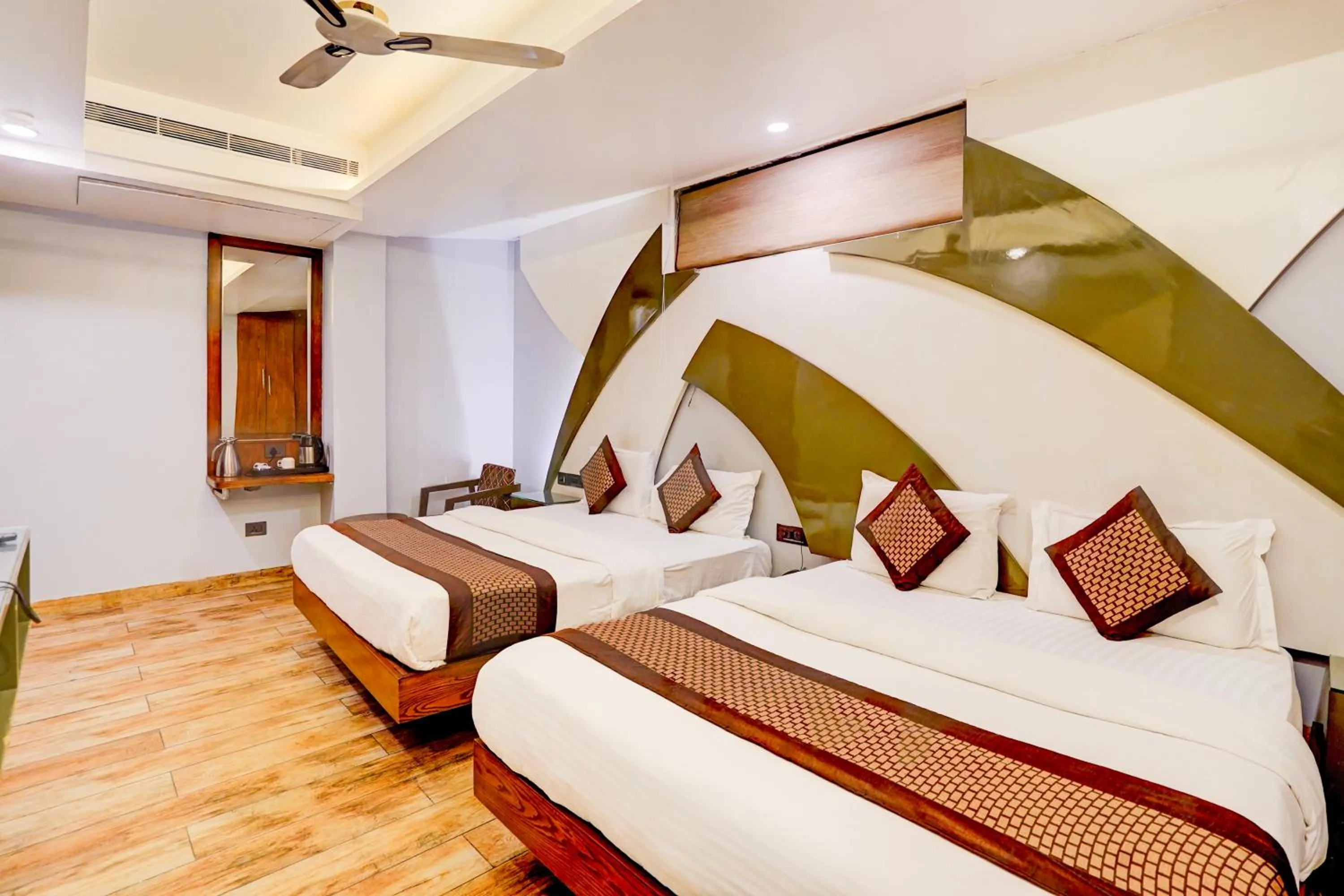 Photo of the whole room, Bed in Staybook Hotel Nitya Maharani, Free Airport Pickup