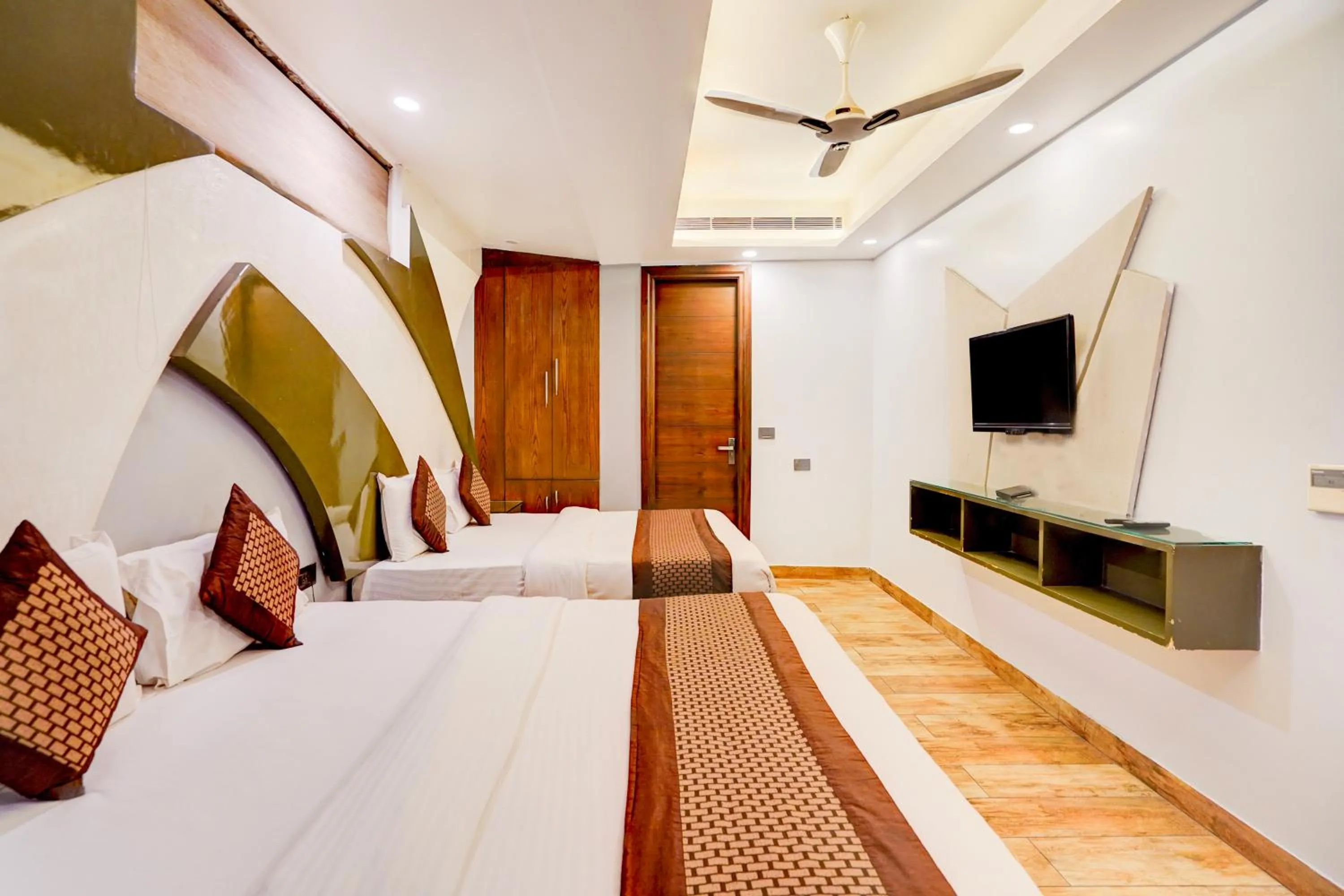 TV and multimedia, Bed in Staybook Hotel Nitya Maharani, Free Airport Pickup