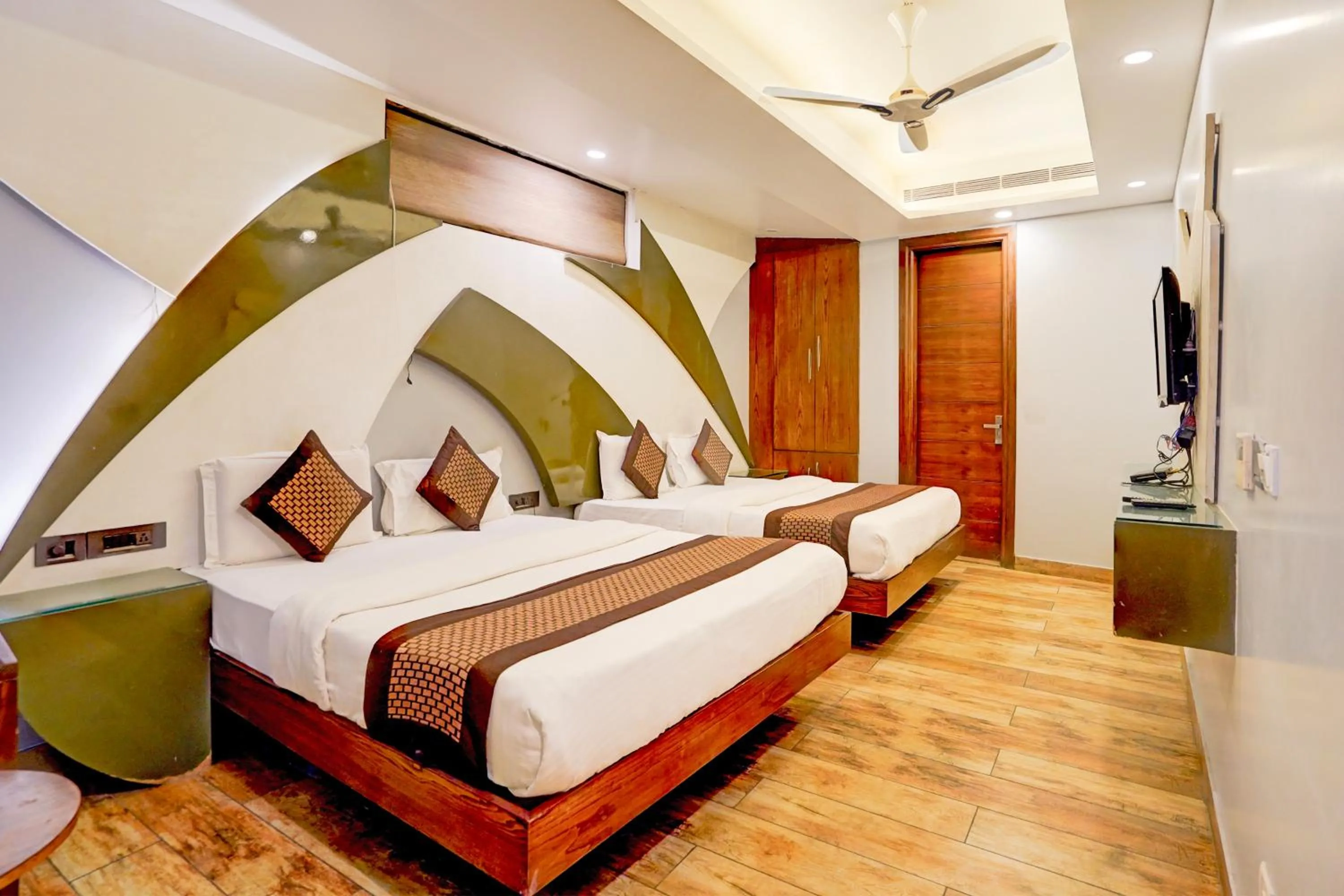 Bed in Staybook Hotel Nitya Maharani, Free Airport Pickup