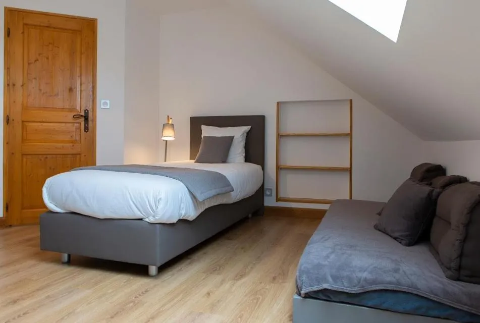 Bed in Gîtes de l'Orée du Bois - Boussières