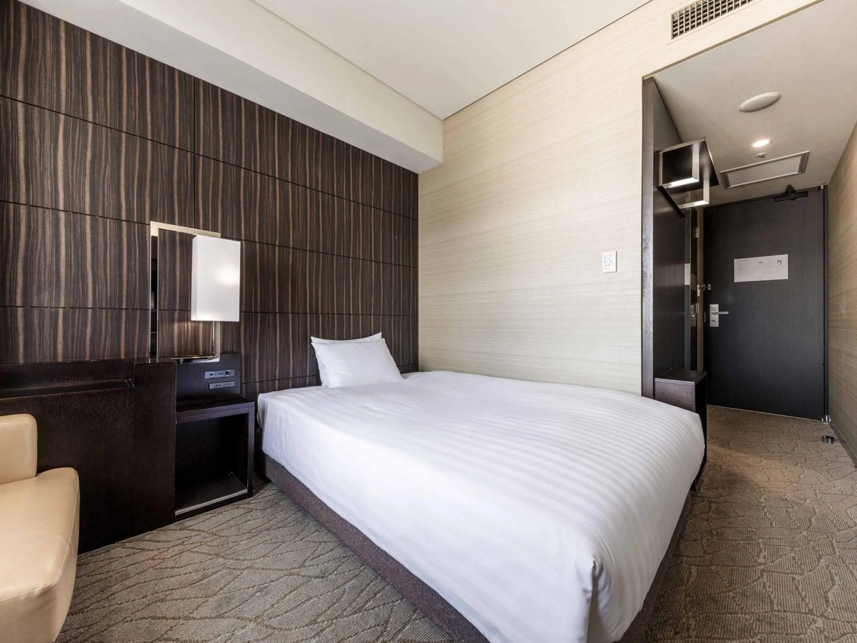 Photo of the whole room, Bed in Solaria Nishitetsu Hotel Kagoshima