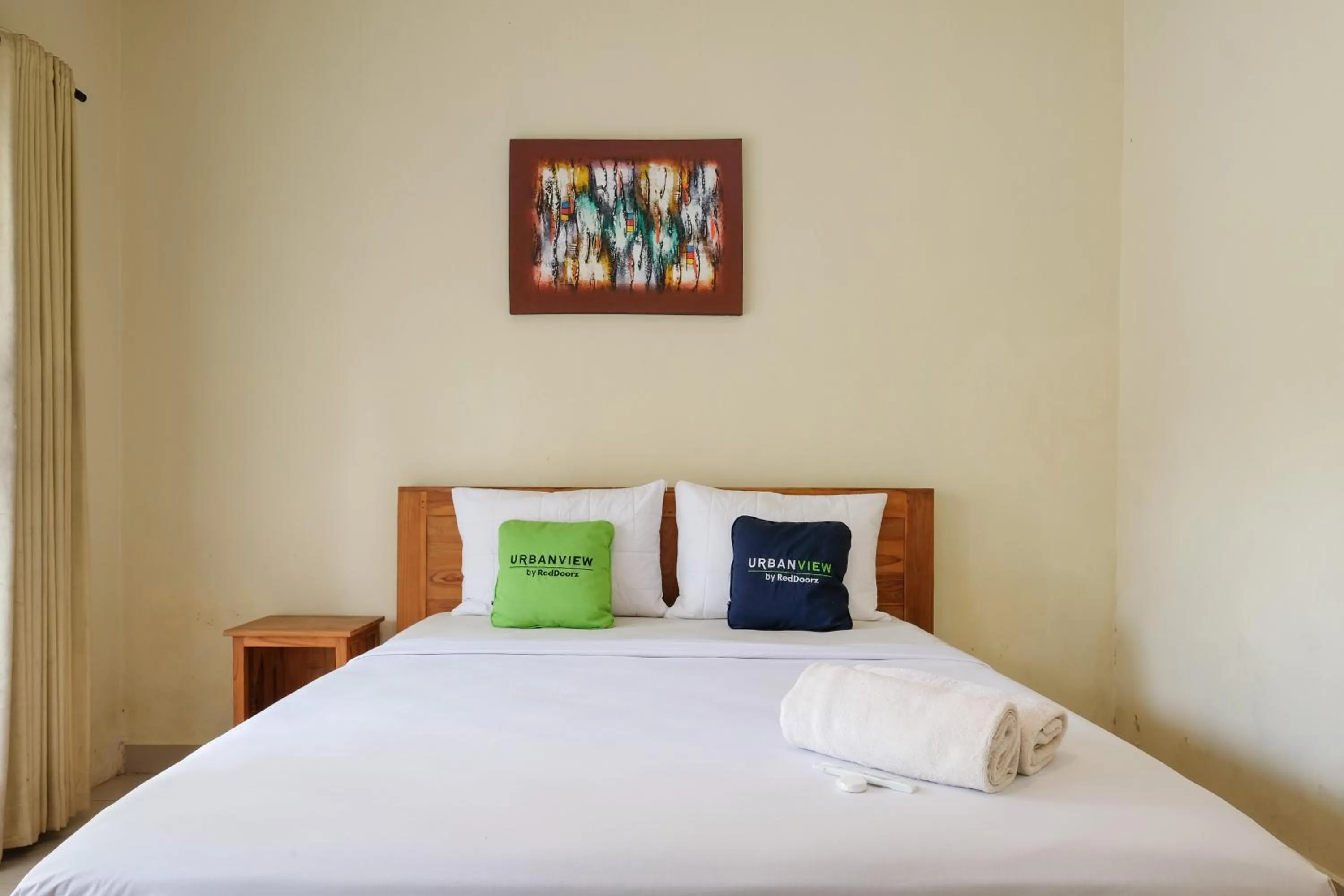 Bed in Urbanview Hotel Lilis Cempaka Mas Guesthouse