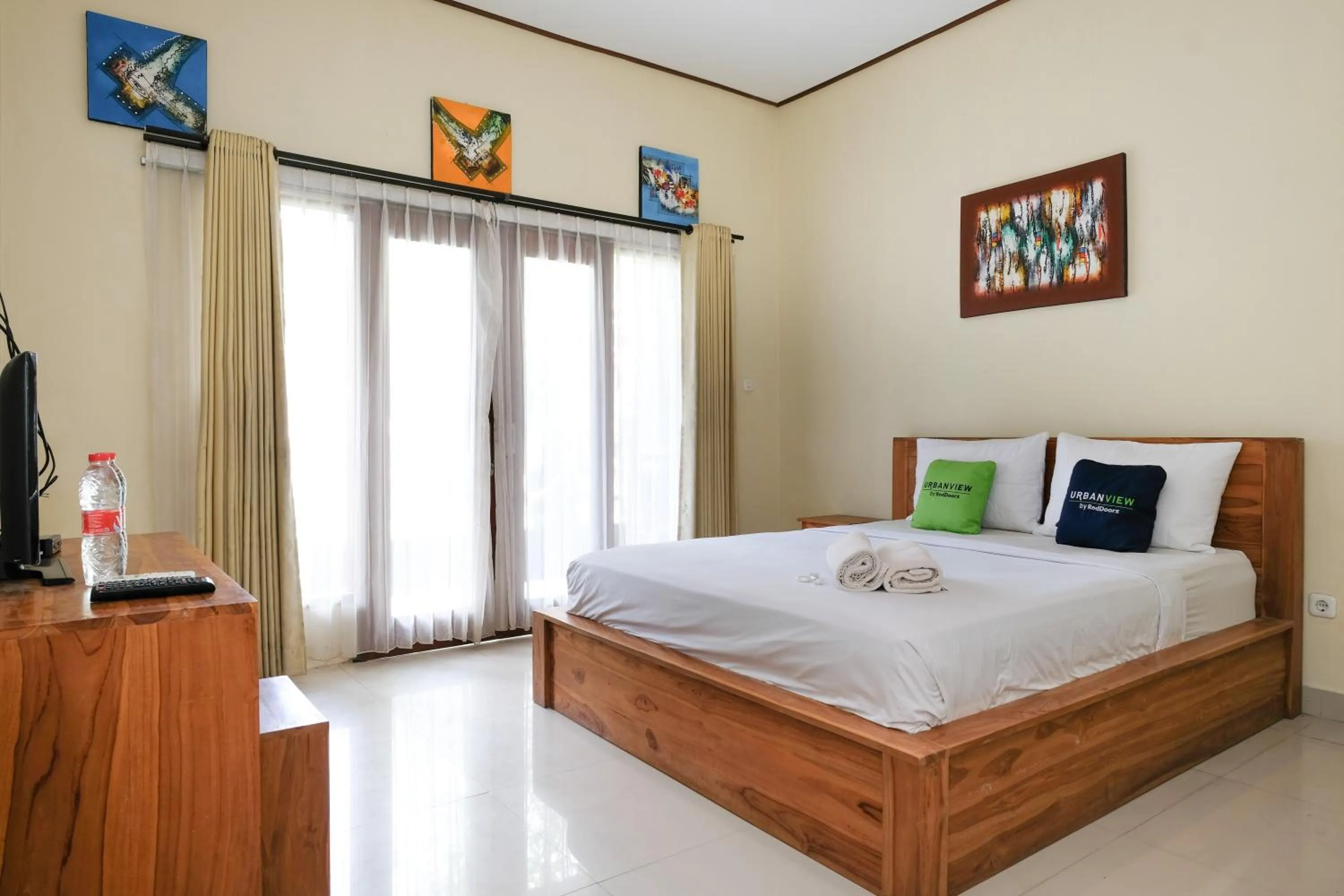 Bed in Urbanview Hotel Lilis Cempaka Mas Guesthouse