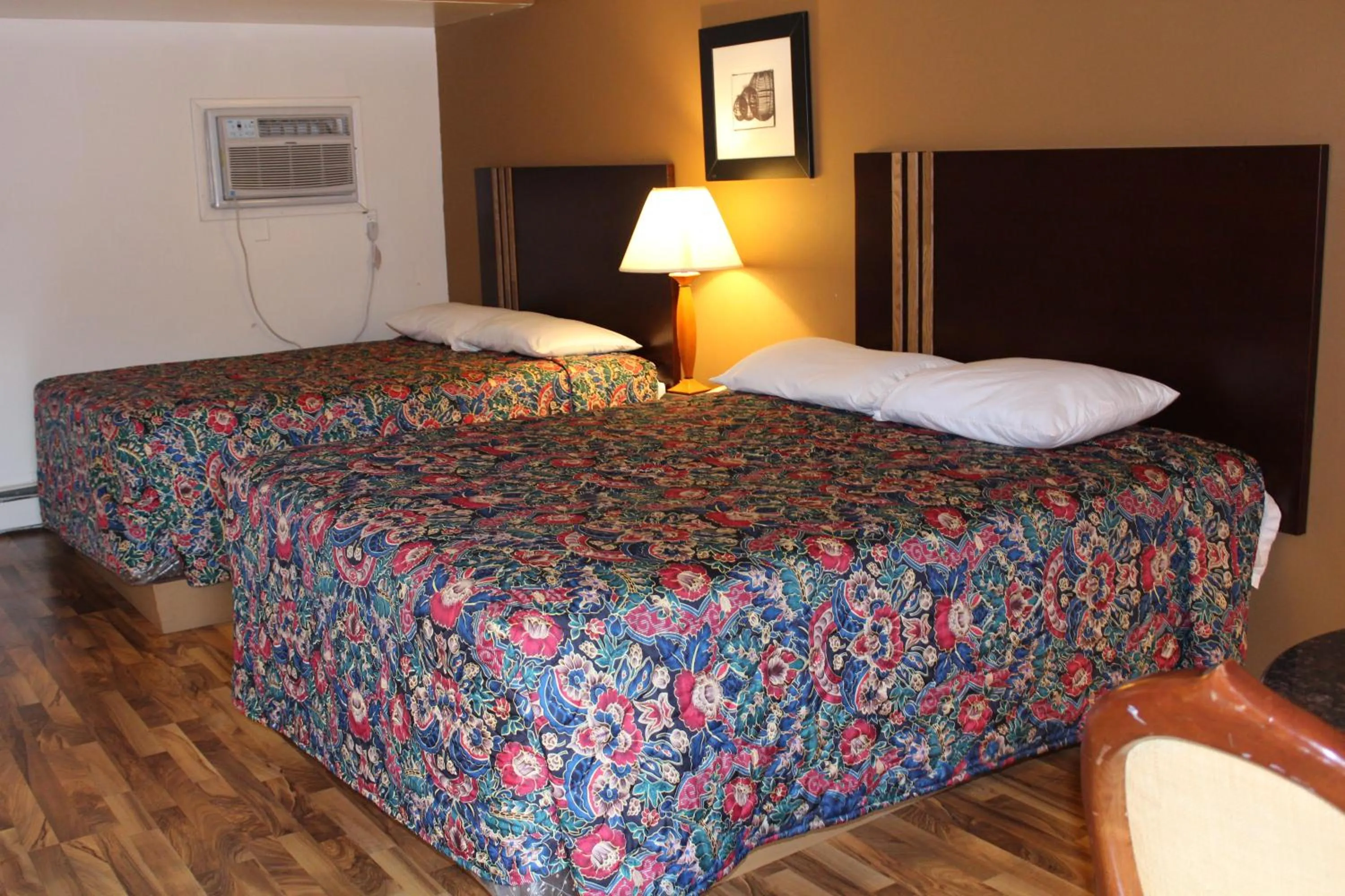 Bed in American Inn and Suites