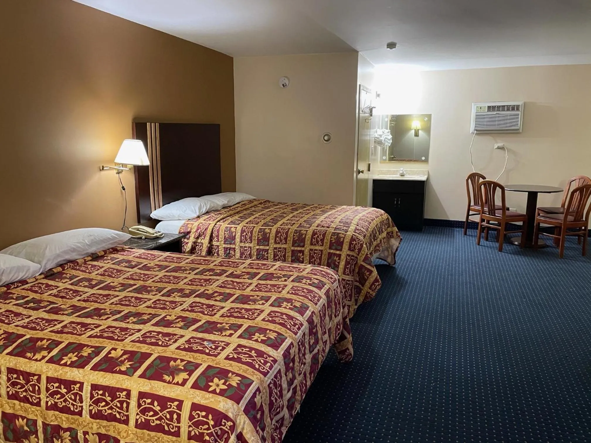 Bed in American Inn and Suites