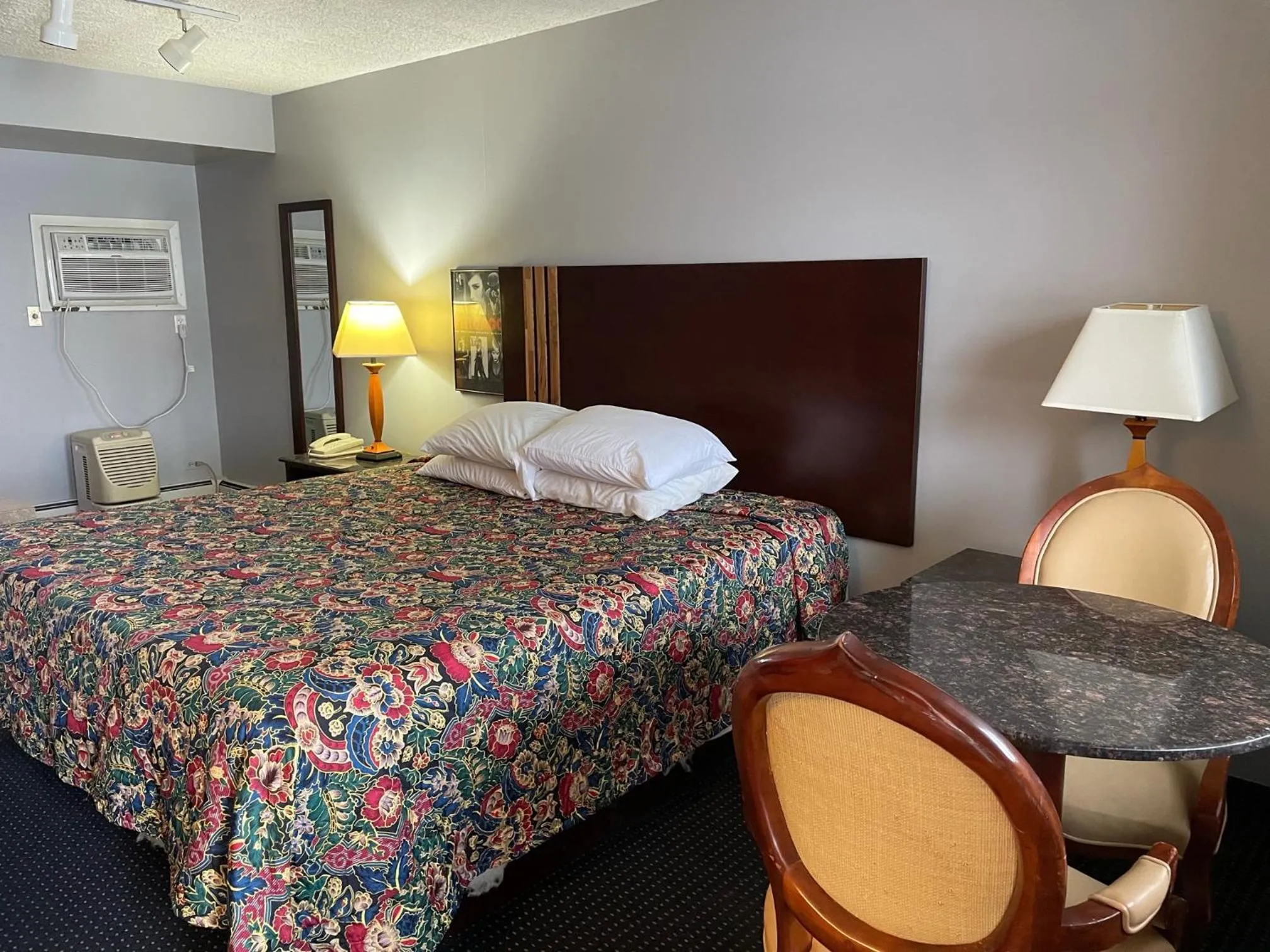 Bed in American Inn and Suites