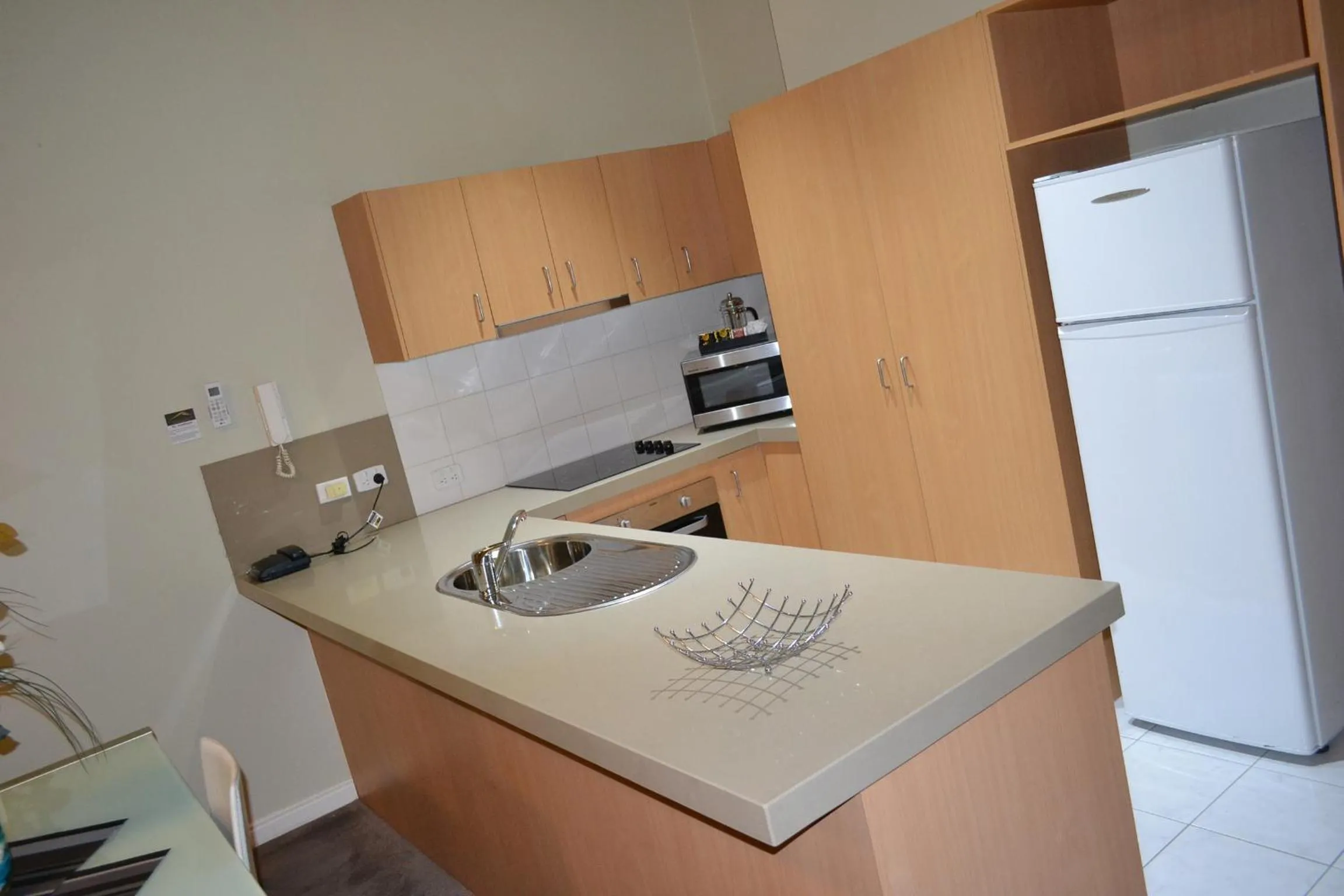 Kitchen or kitchenette in Flinders Landing Apartments