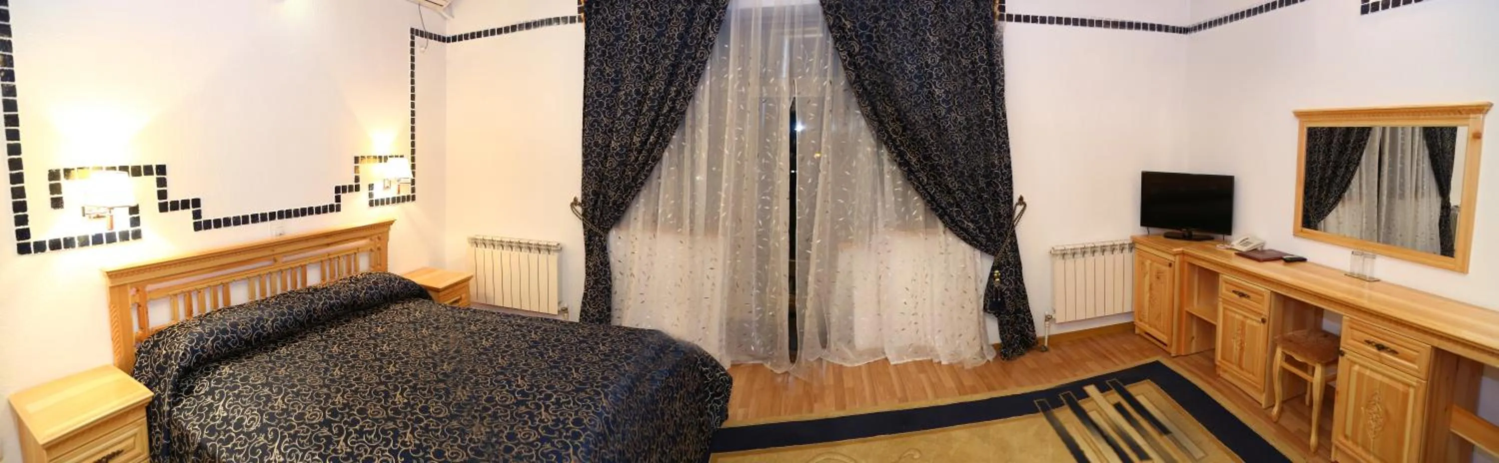 Photo of the whole room, Bed in Malika Prime Hotel