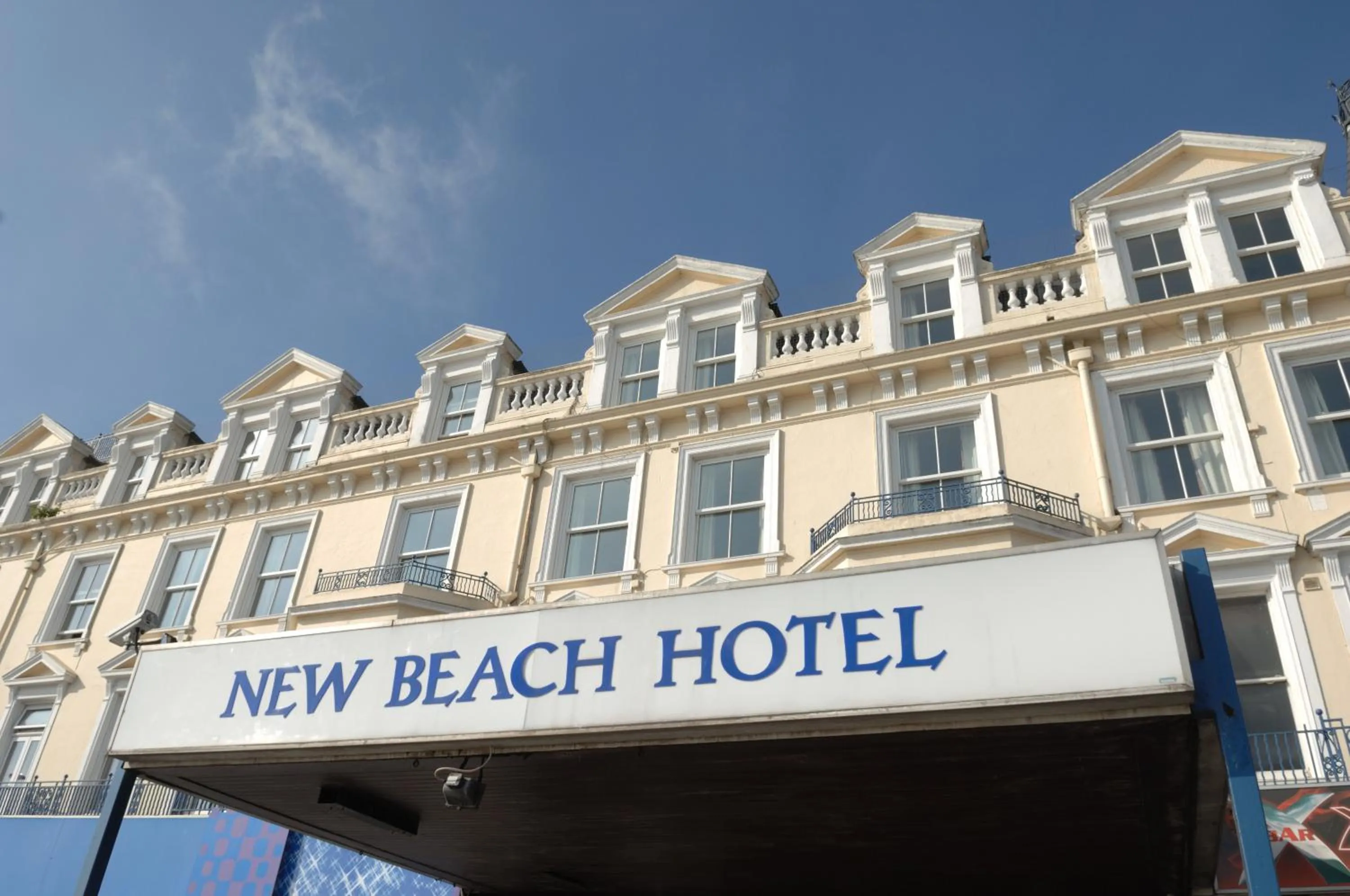 Facade/entrance in New Beach Hotel
