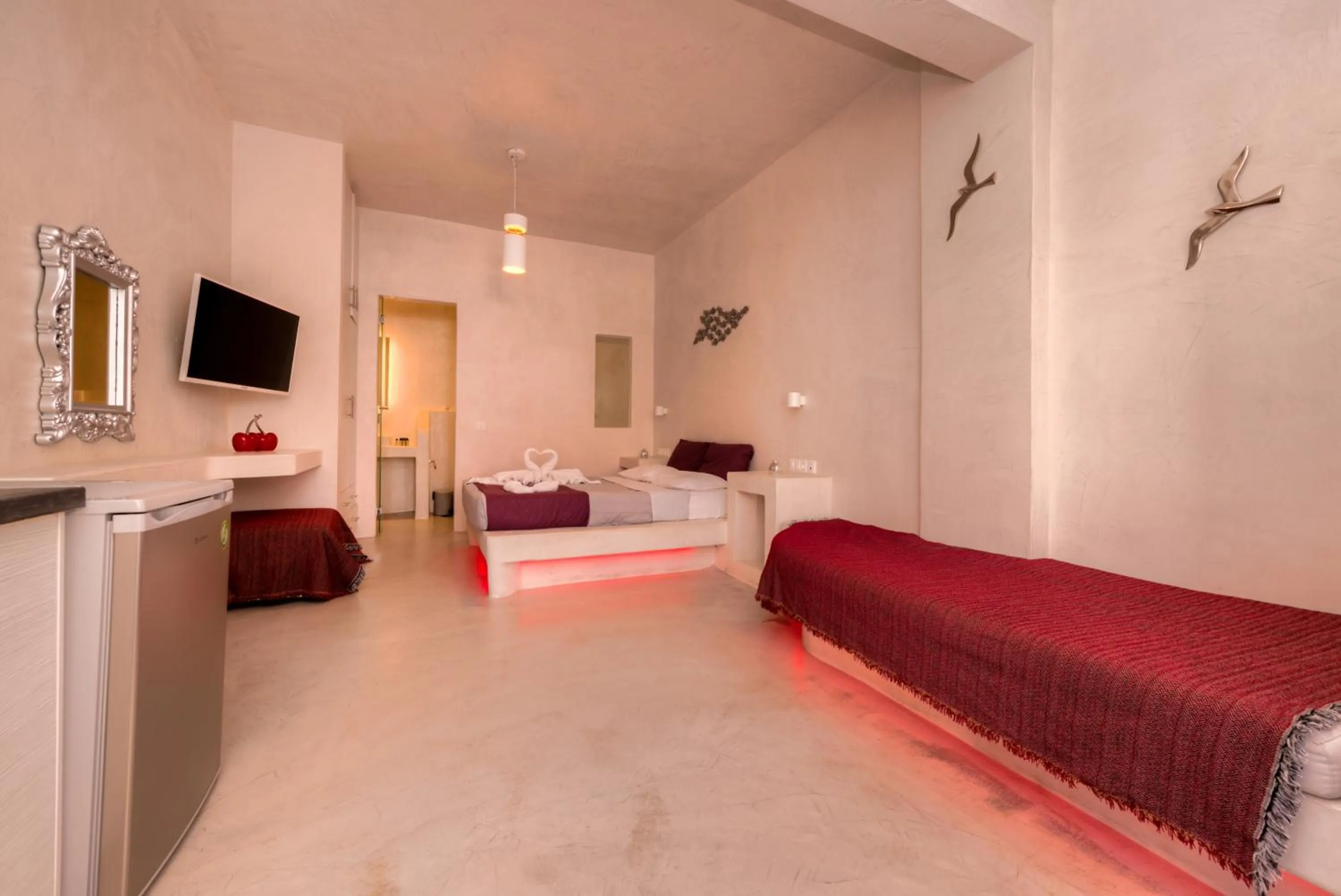 Photo of the whole room, Bed in The Muses of Santorini Private Jacuzzi Suites