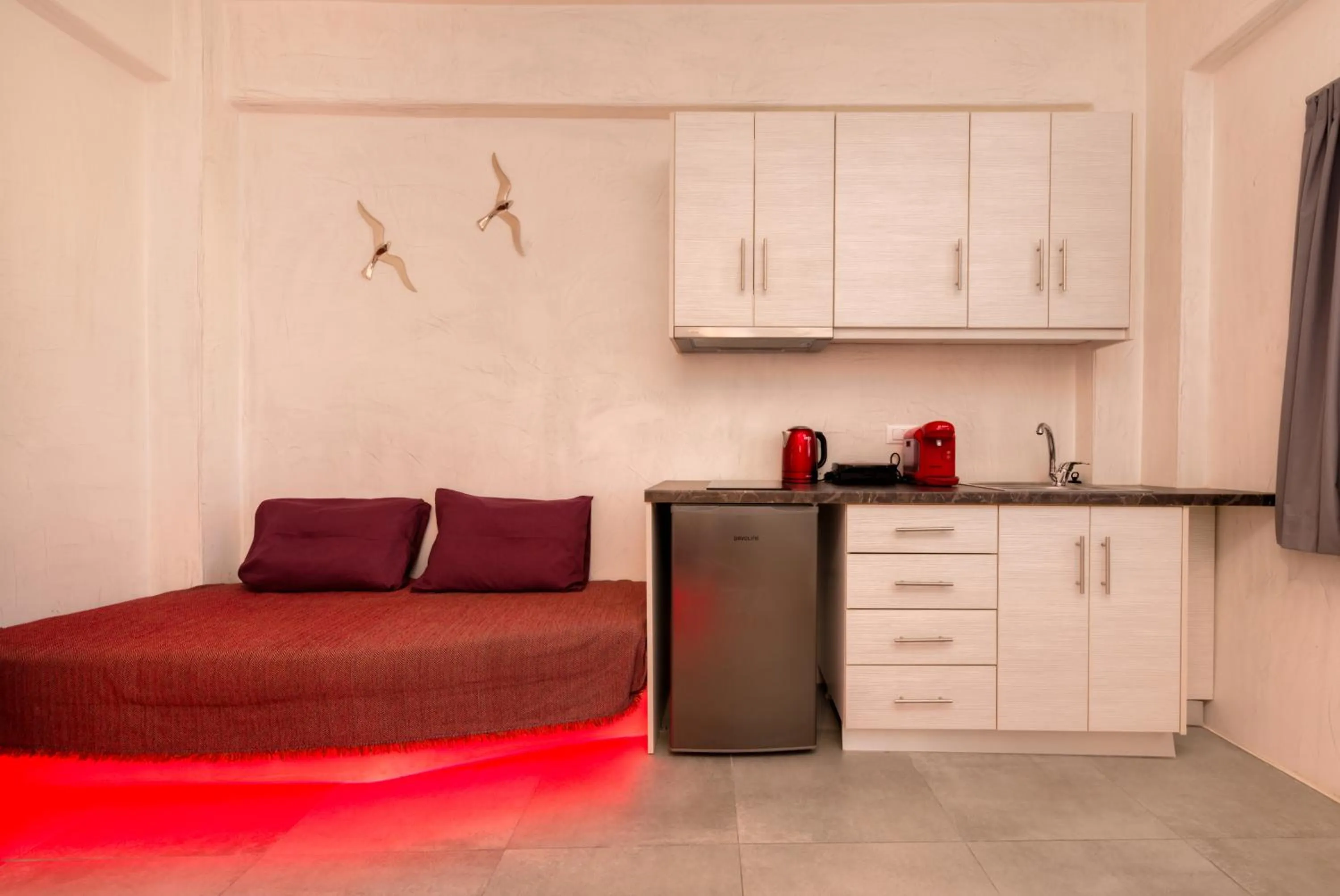 Kitchen or kitchenette in The Muses of Santorini Private Jacuzzi Suites