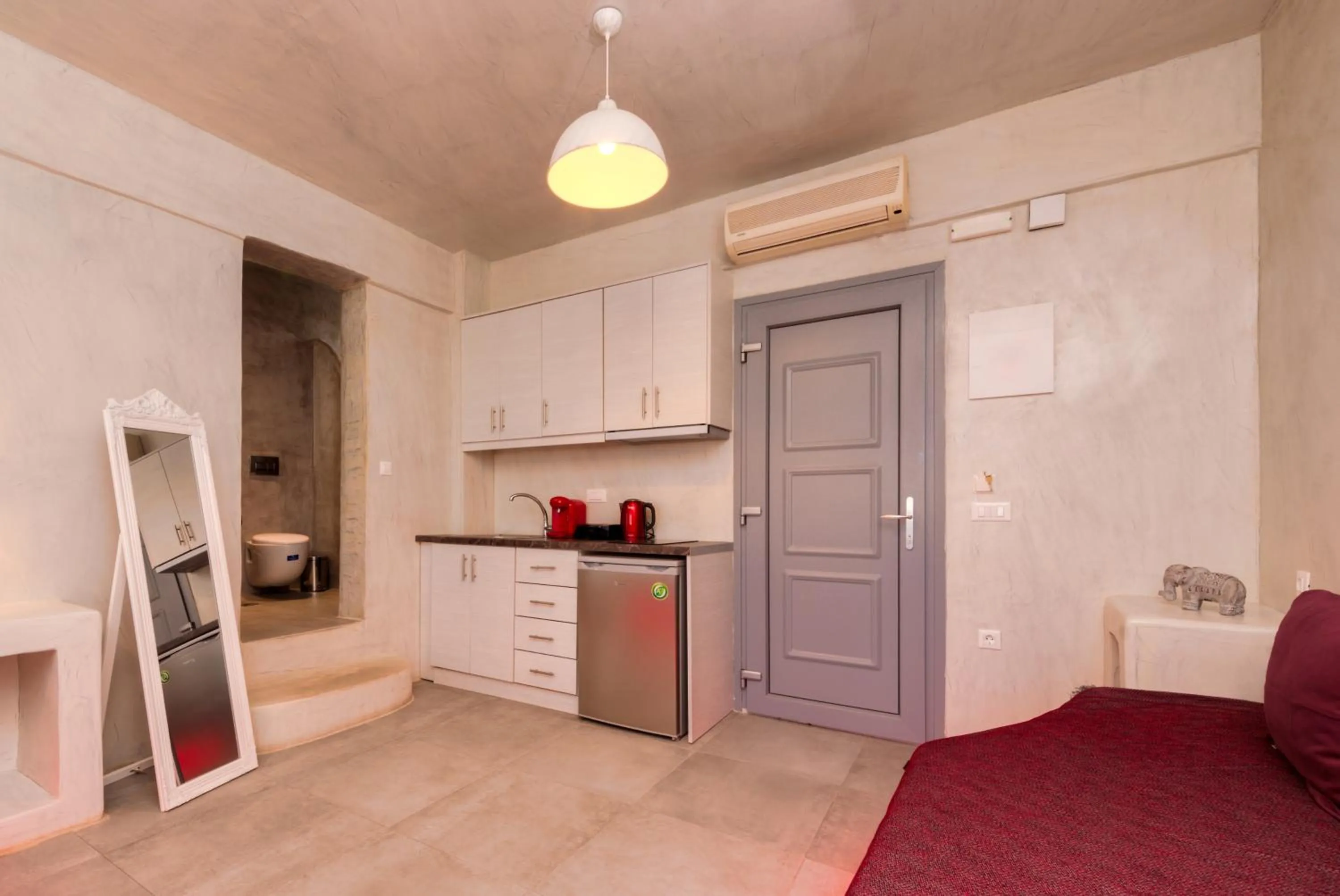 Kitchen or kitchenette in The Muses of Santorini Private Jacuzzi Suites