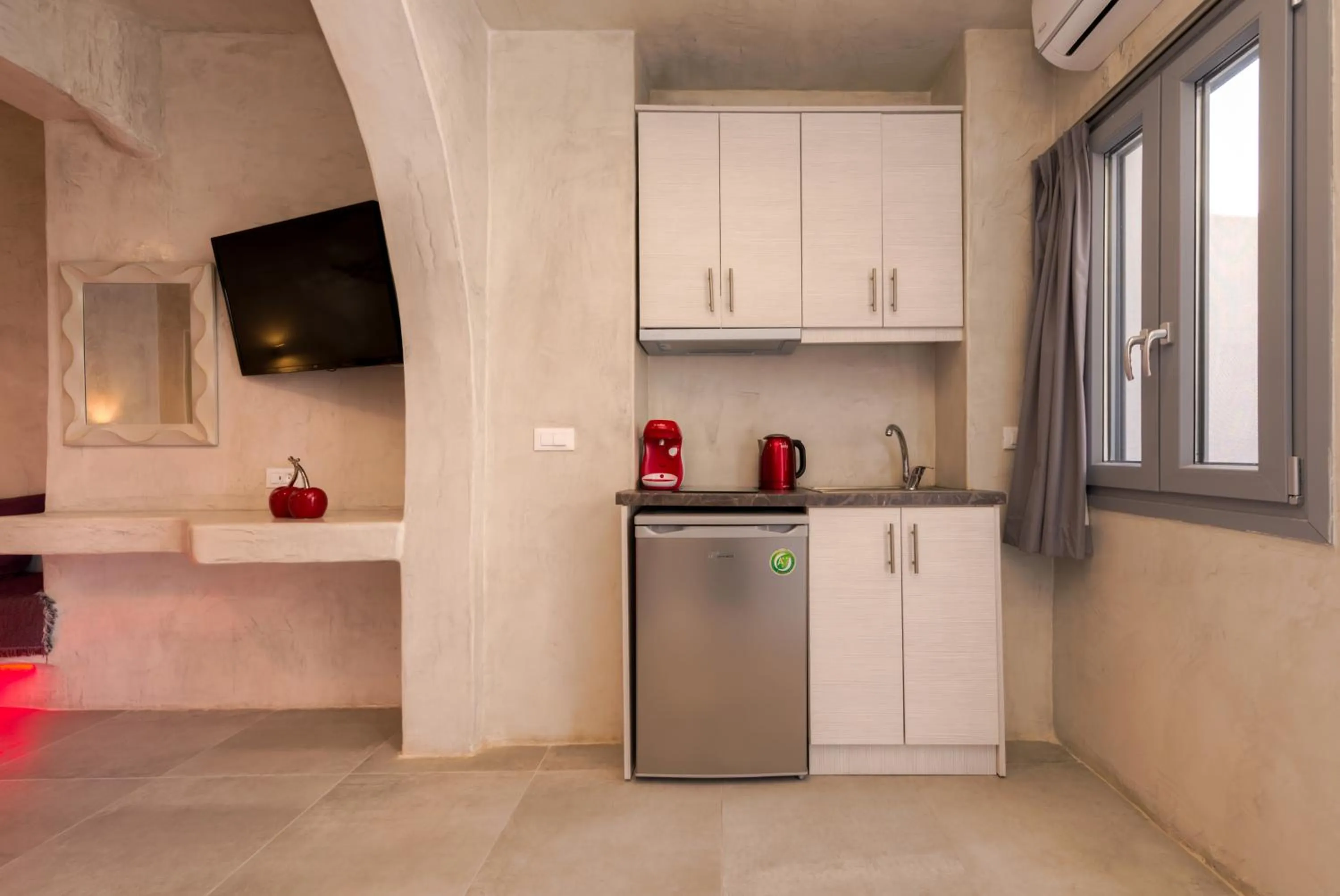 Kitchen or kitchenette in The Muses of Santorini Private Jacuzzi Suites