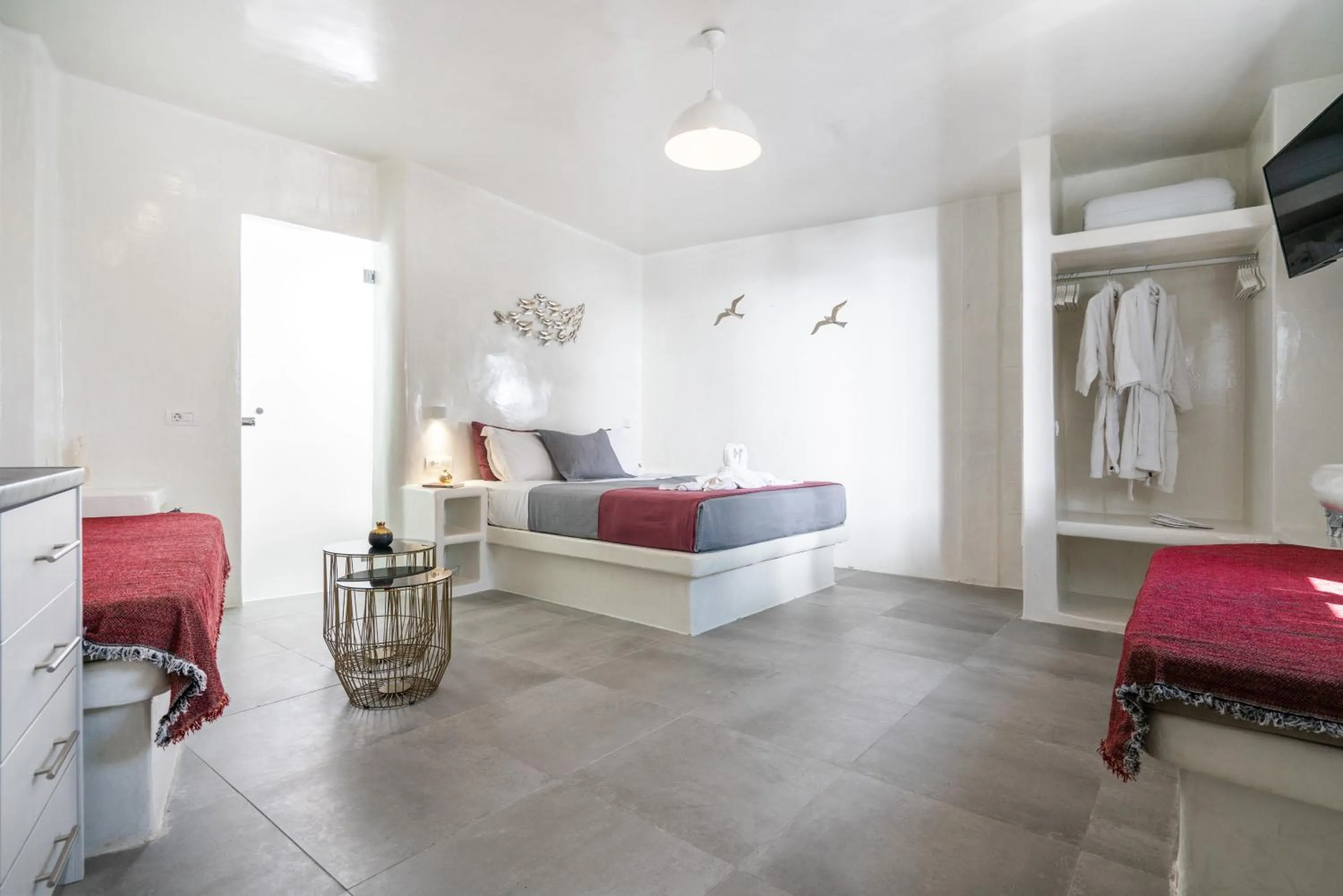 Bed in The Muses of Santorini Private Jacuzzi Suites