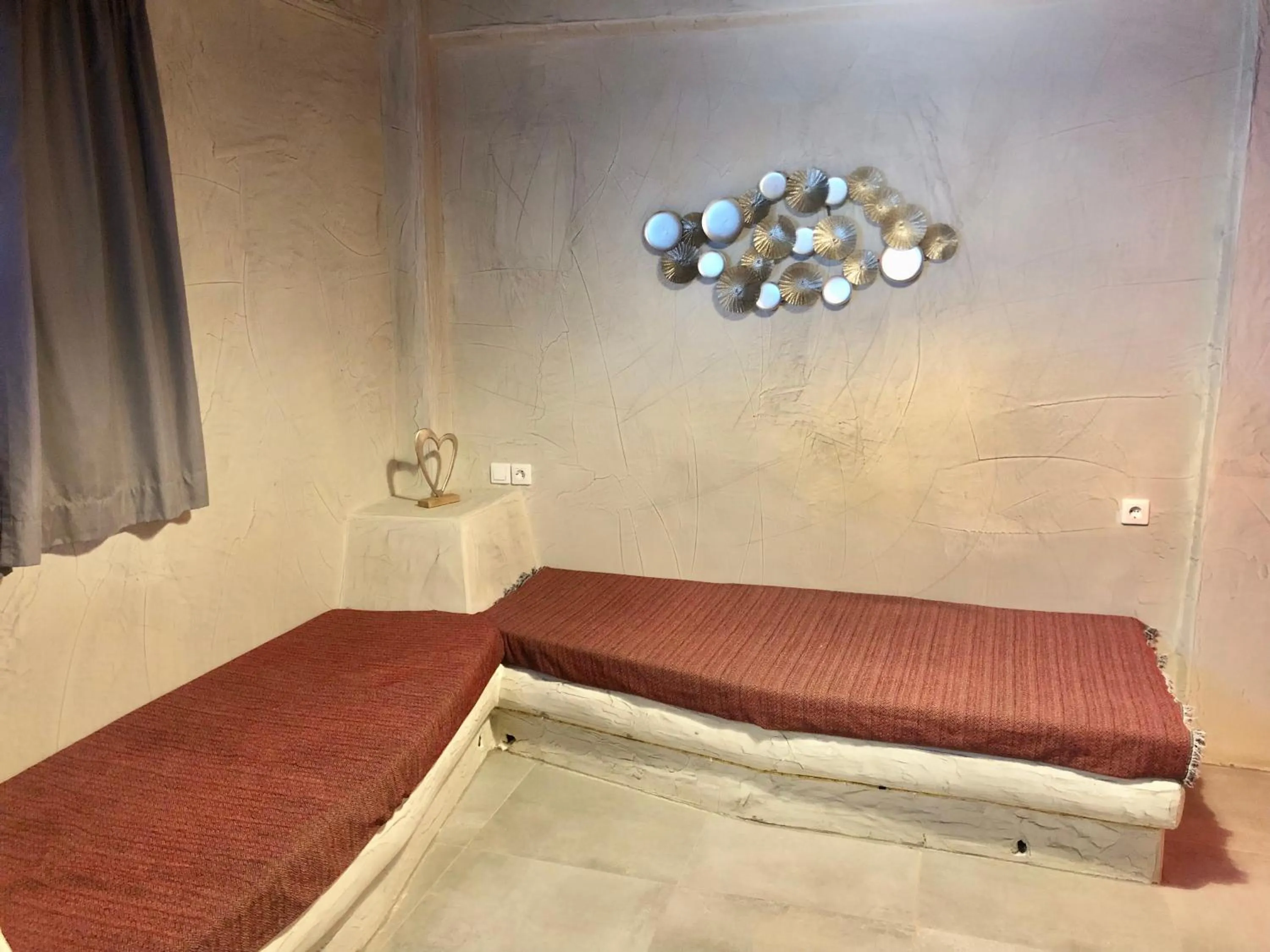 Seating area in The Muses of Santorini Private Jacuzzi Suites