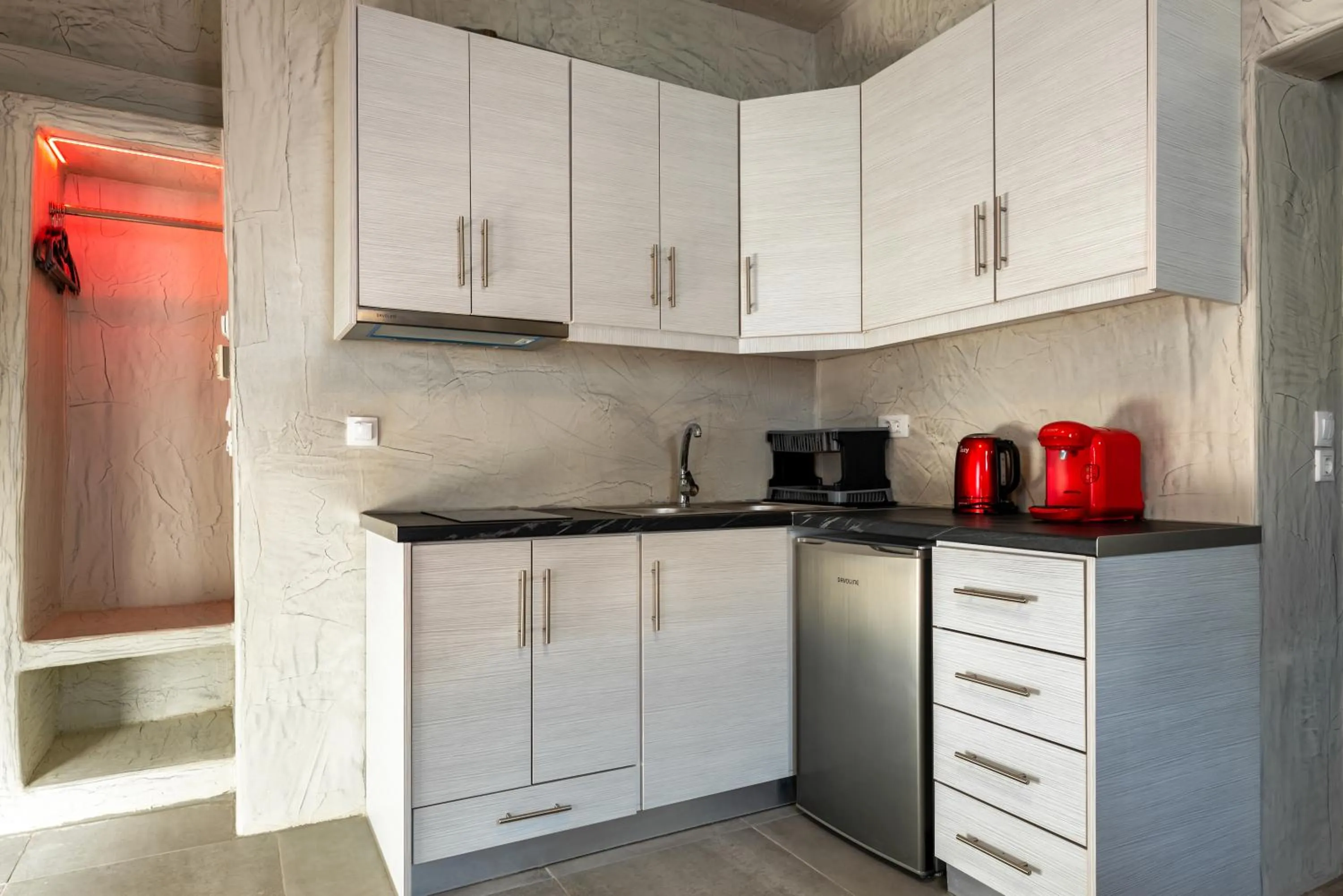 Kitchen or kitchenette in The Muses of Santorini Private Jacuzzi Suites