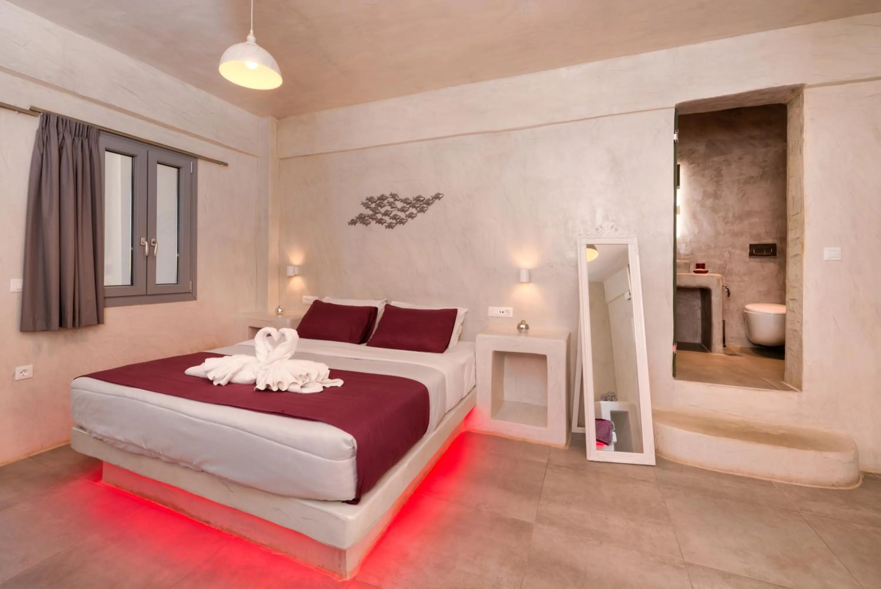 Bed in The Muses of Santorini Private Jacuzzi Suites