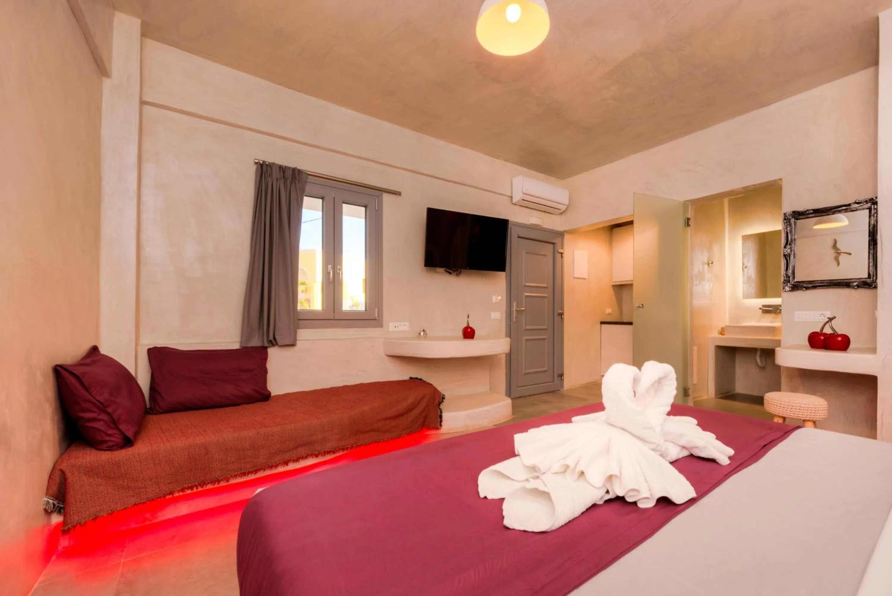 Bed in The Muses of Santorini Private Jacuzzi Suites