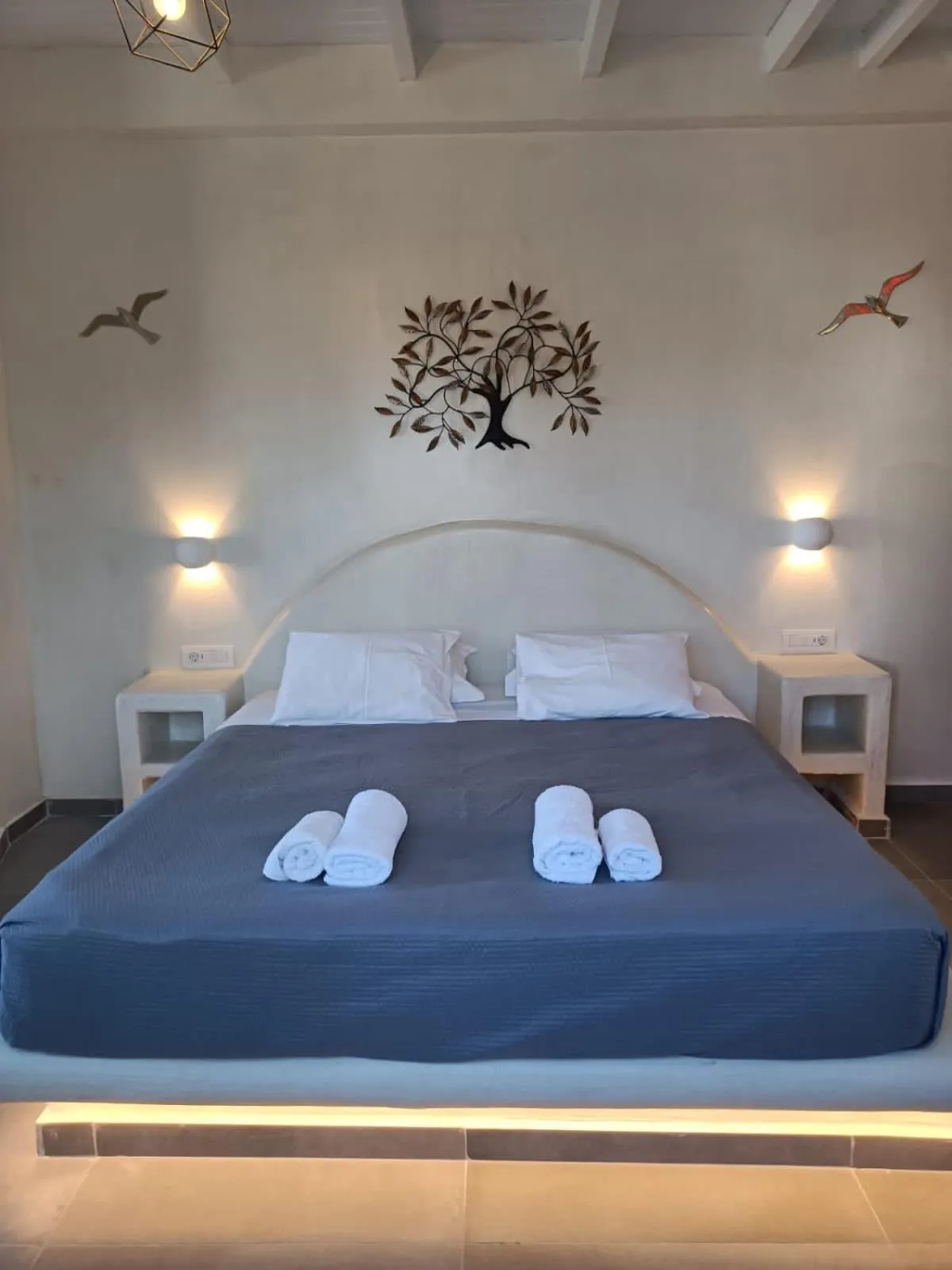 Bed in The Muses of Santorini Private Jacuzzi Suites