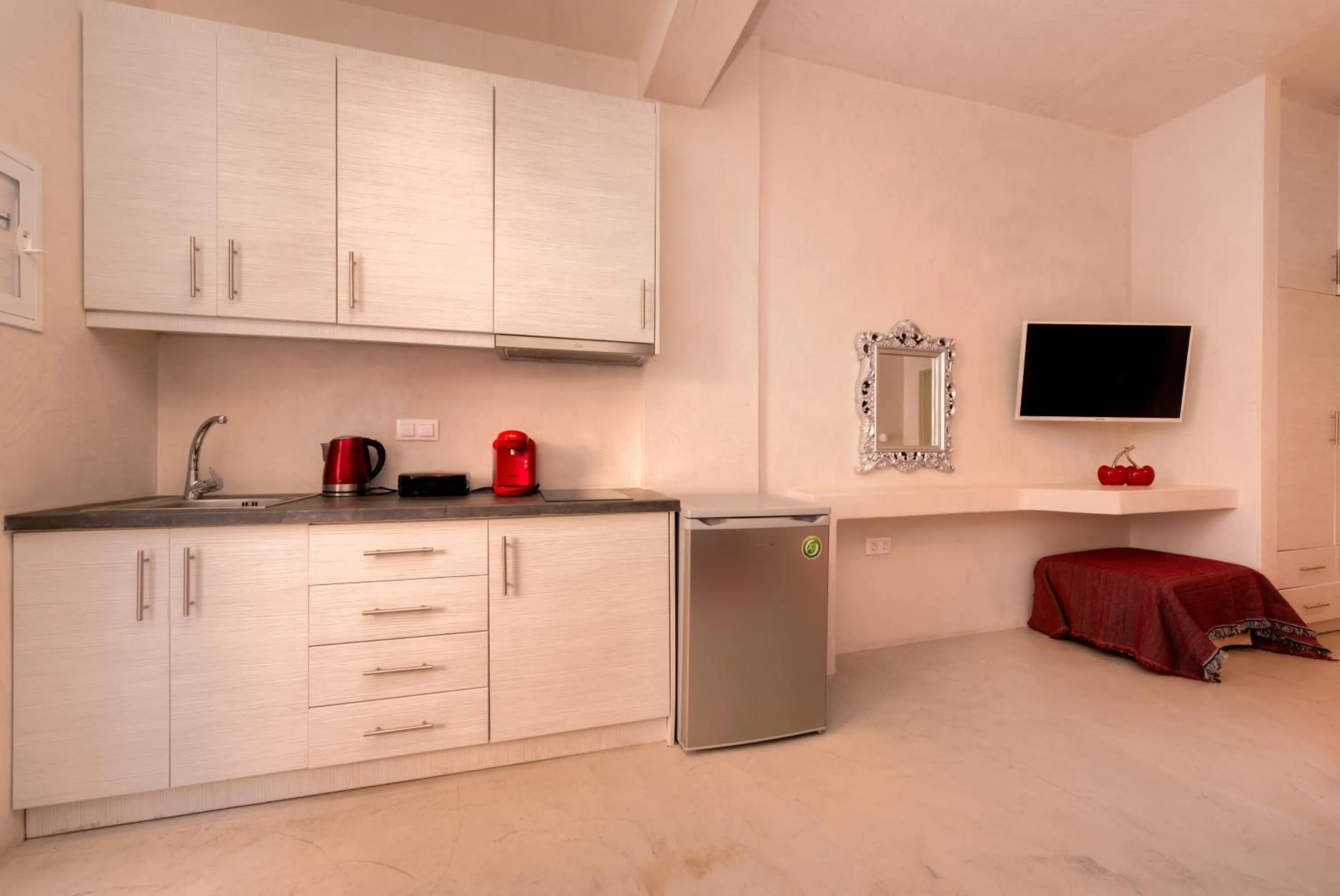 Kitchen or kitchenette in The Muses of Santorini Private Jacuzzi Suites