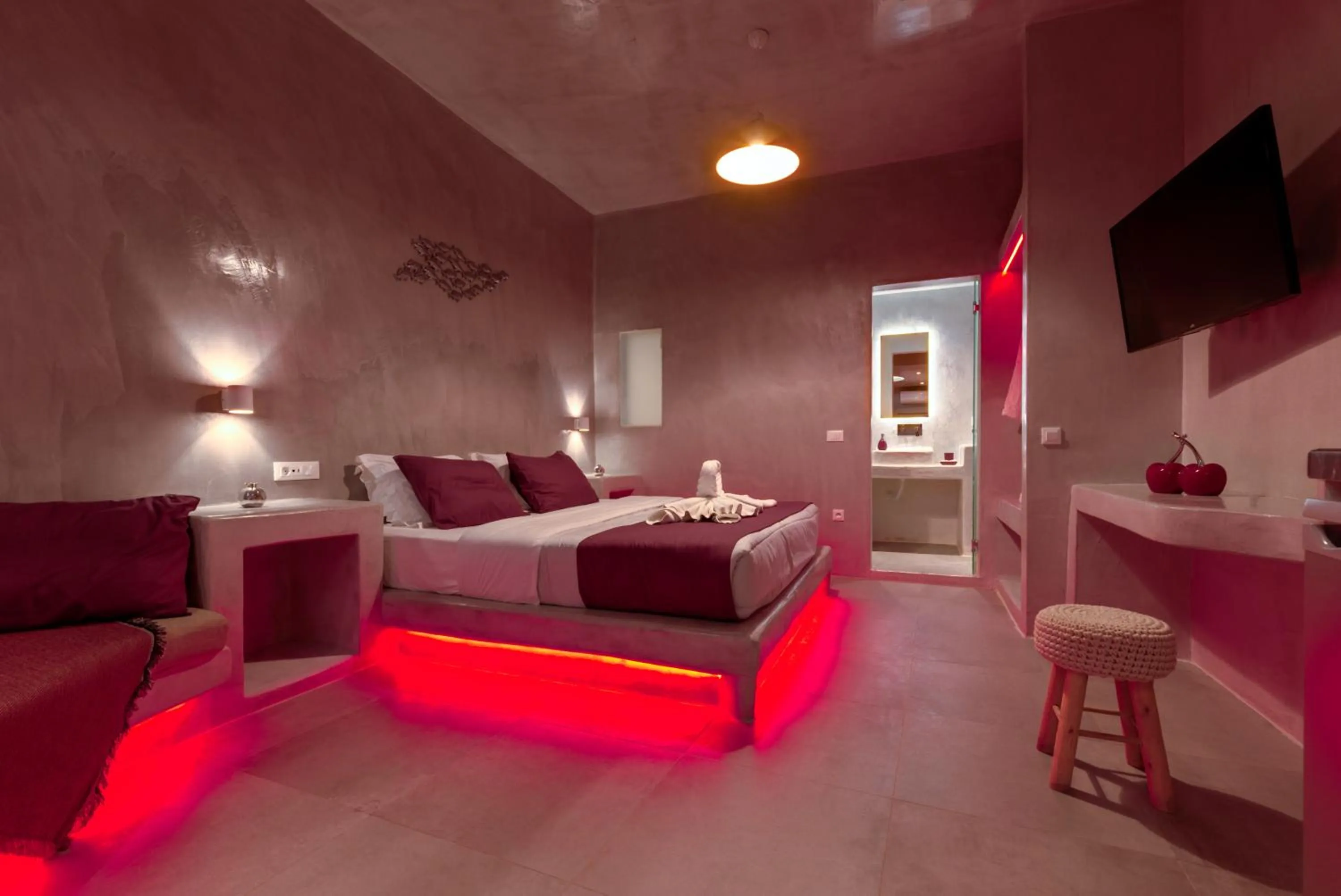 Photo of the whole room, Bed in The Muses of Santorini Private Jacuzzi Suites