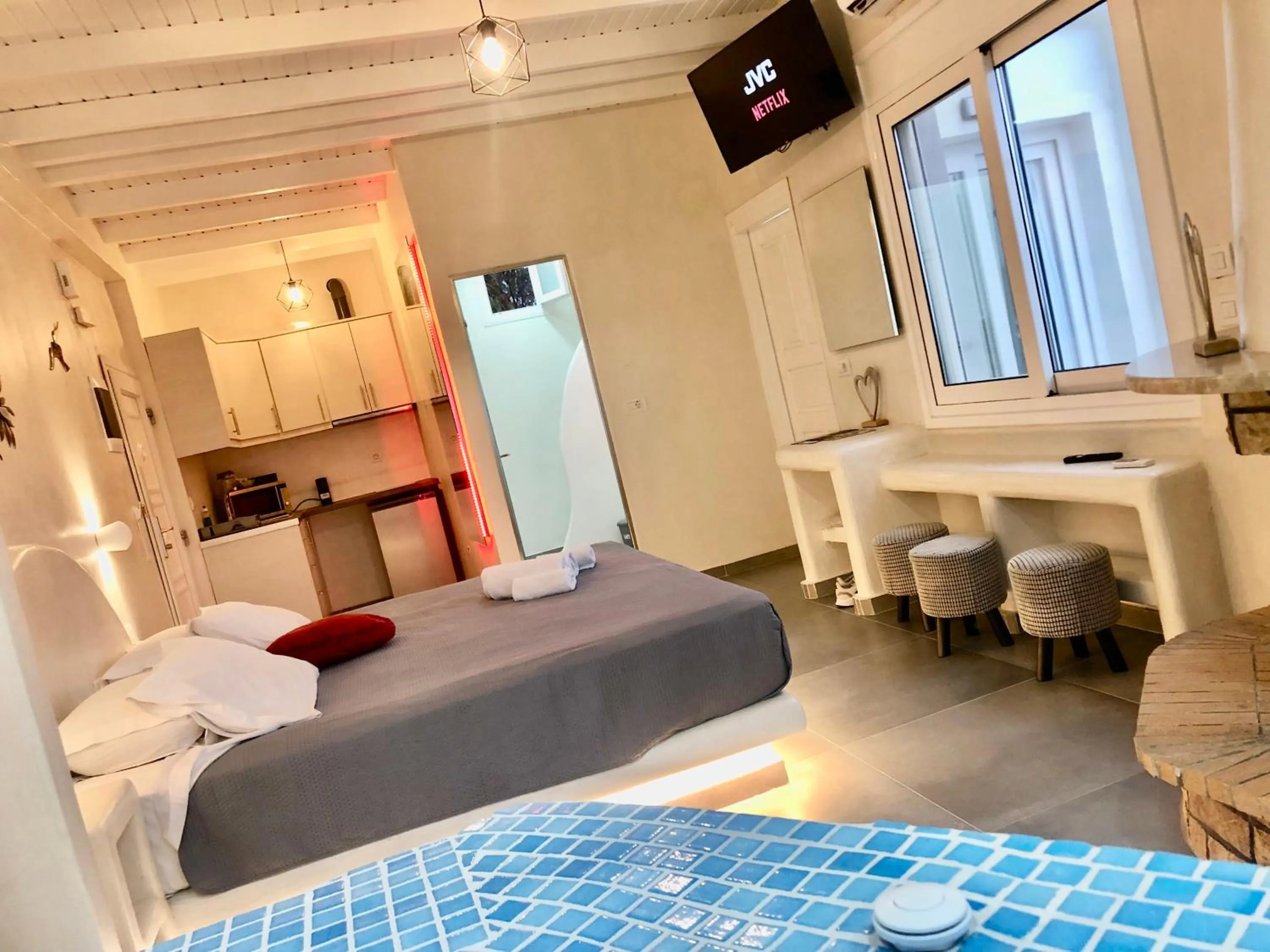 Photo of the whole room, Bed in The Muses of Santorini Private Jacuzzi Suites