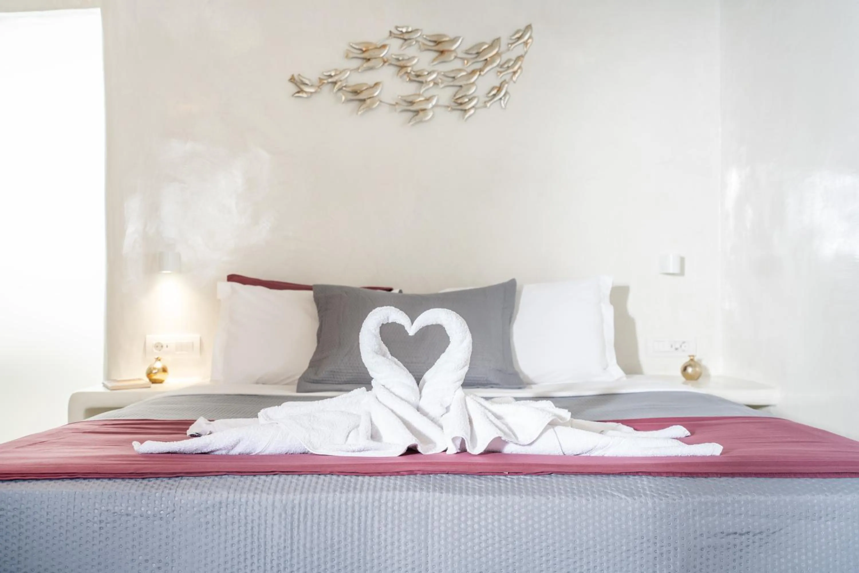 Bed in The Muses of Santorini Private Jacuzzi Suites