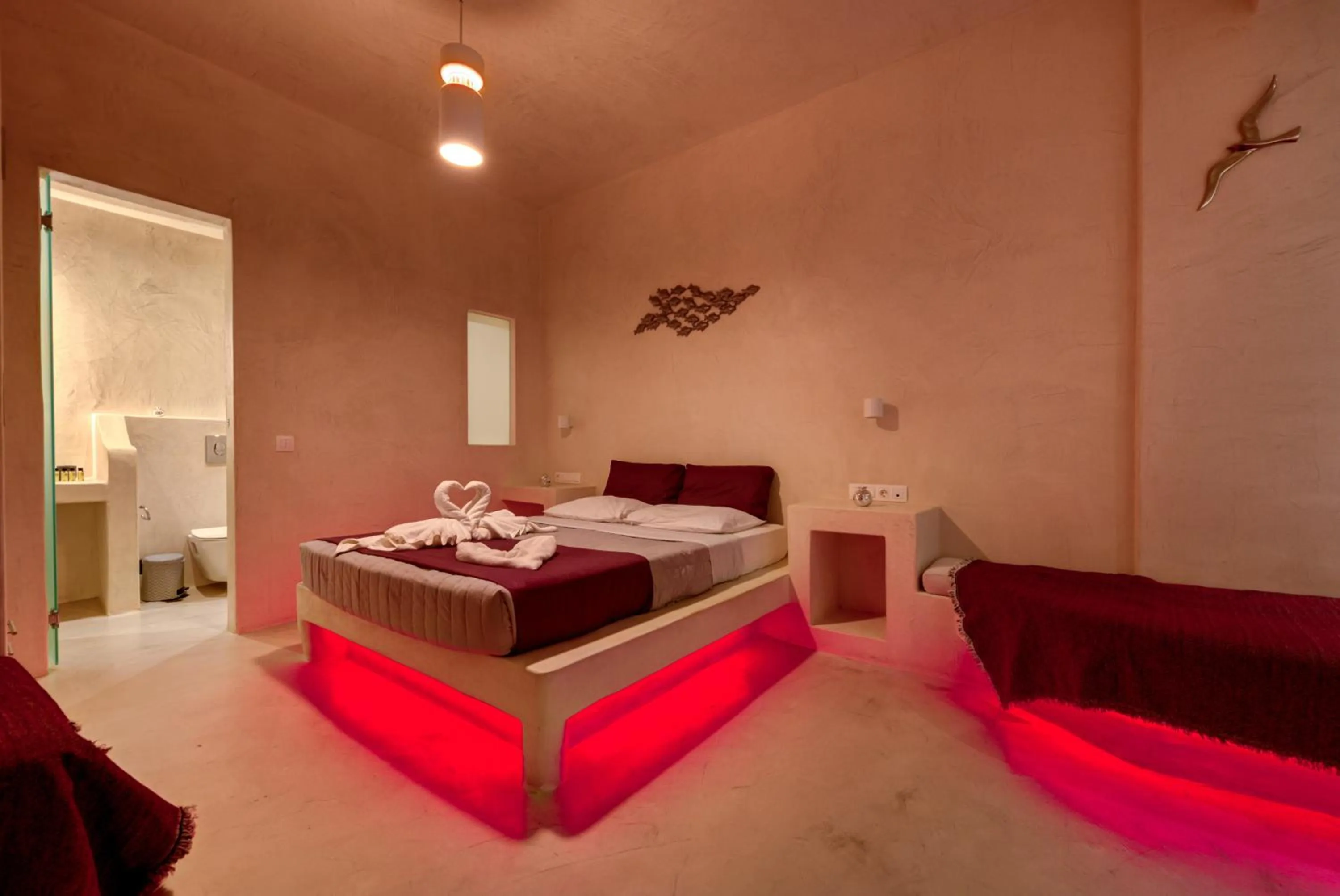 Bedroom, Bed in The Muses of Santorini Private Jacuzzi Suites