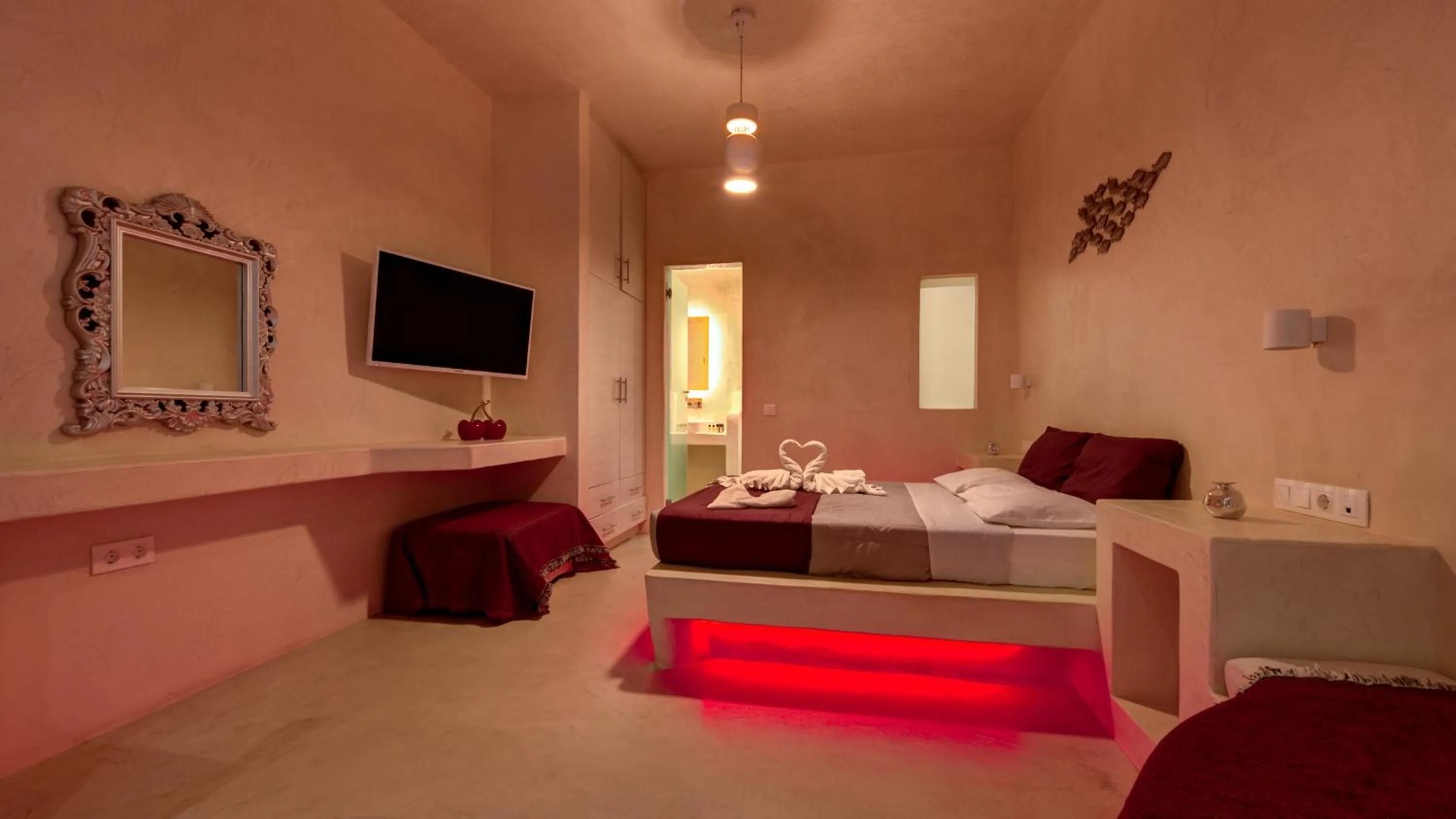 Photo of the whole room, Bed in The Muses of Santorini Private Jacuzzi Suites